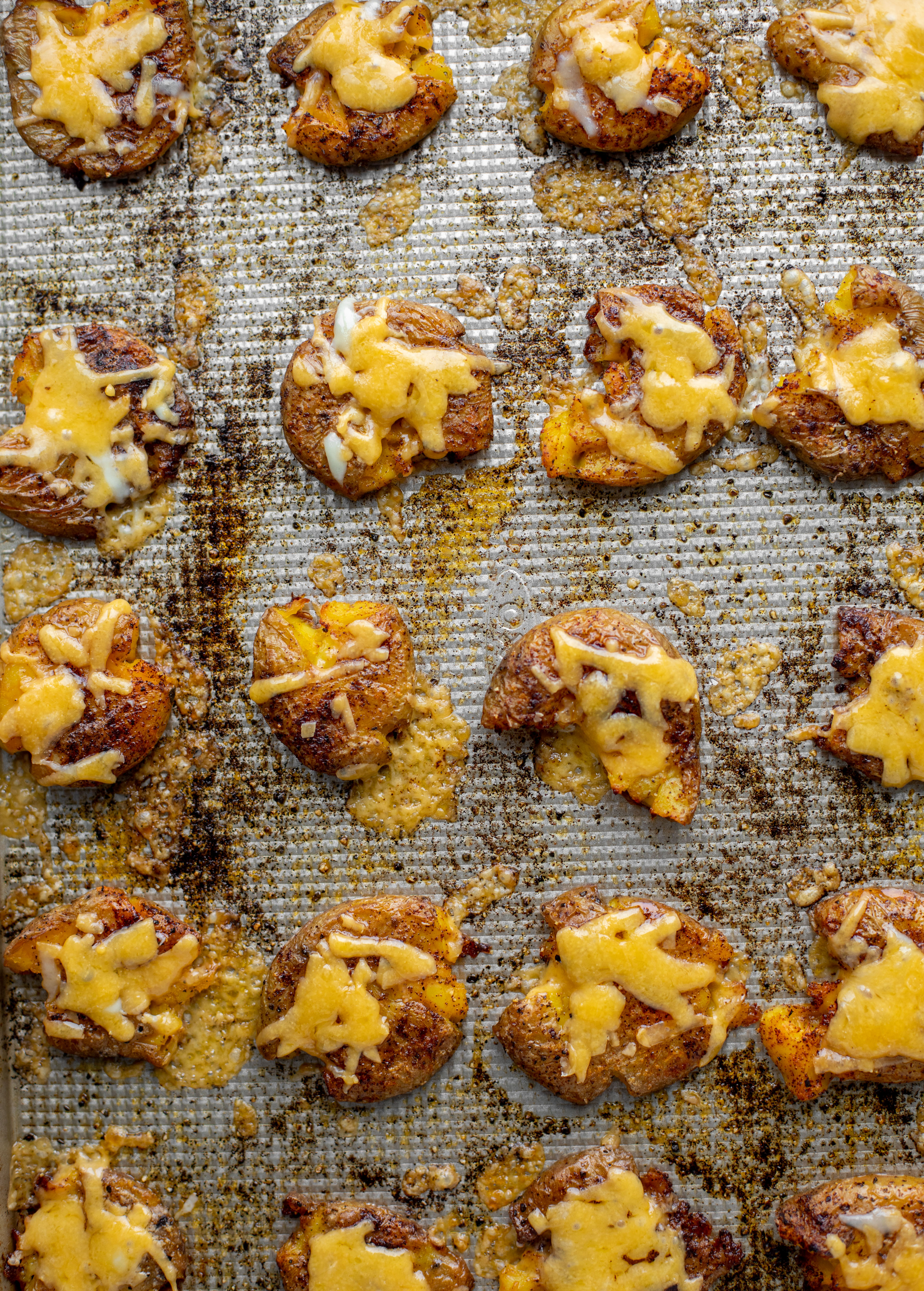 smashed chipotle cheddar potatoes on baking sheet