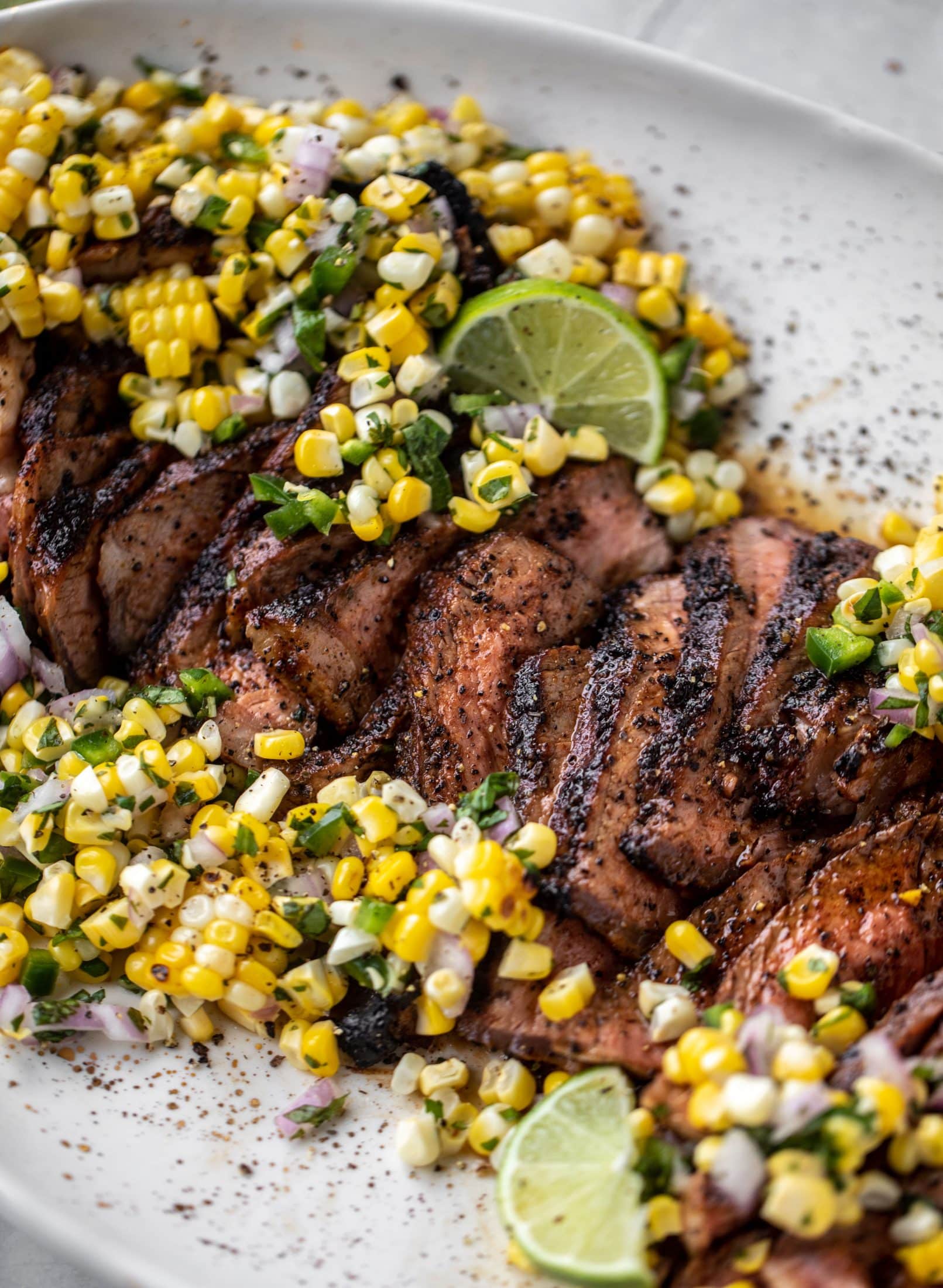 This coffee crusted steak is incredibly flavorful! Topped with a fresh and bright herbed corn salsa, it's the perfect meal to kick off summer.
