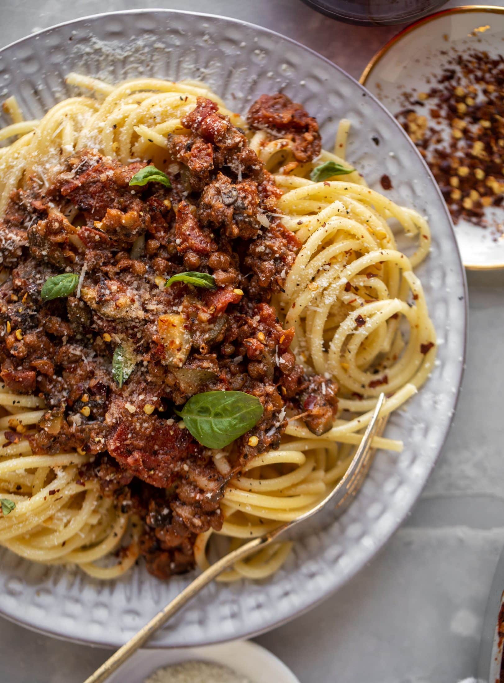 up close lentil bolognese with a fork