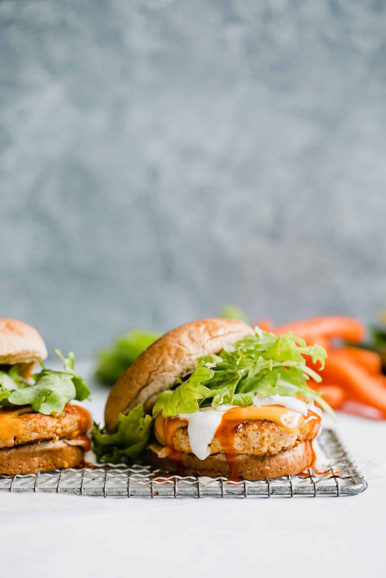 buffalo chicken burgers I howsweeteats.com #buffalo #chicken #burgers