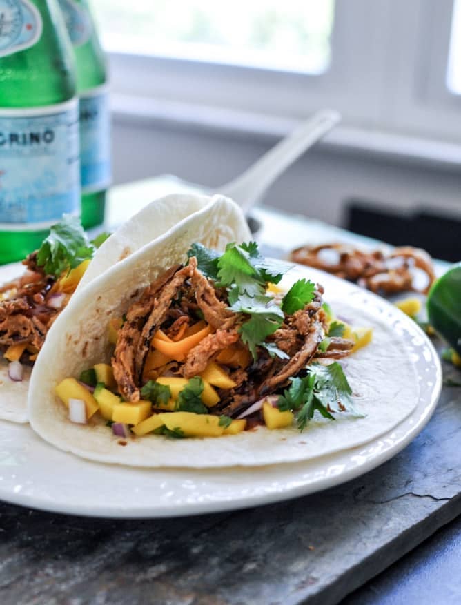 Crockpot BBQ Beer Pulled Pork Tacos with Crispy Onion Straws and Mango Salsa I howsweeteats.com Crockpot BBQ Beer Pulled Pork Tacos with Crispy Onion Straws and Mango Salsa I howsweeteats.com