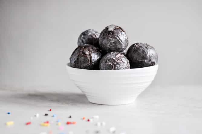 Glazed and Sprinkled Chocolate Cake Donut Holes I howsweeteats.com Glazed and Sprinkled Chocolate Cake Donut Holes I howsweeteats.com