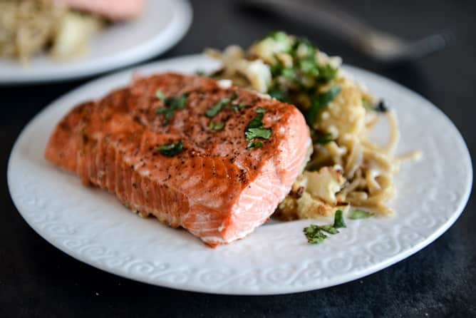 Broiled Salmon and Roasted Garlic Cream Noodles with Crispy Cauliflower + Toasted Pine Nuts I howsweeteats.com