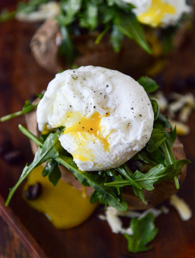 Cheesy Black Bean Stuffed Sweet Potatoes with Arugula + Poached Eggs I howsweeteats.com
