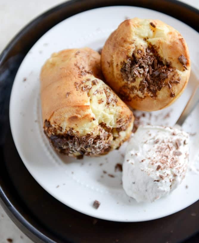 Dark Chocolate Chunk Popovers with Spiked Vanilla Bourbon Whipped Cream I howsweeteats.com