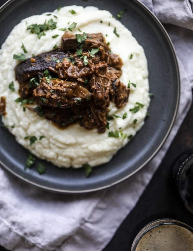 guinness short ribs with cheesy cauliflower mash I howsweeteats.com #slowcooker #guinness #shortribs #saintpatricksday #cauliflower