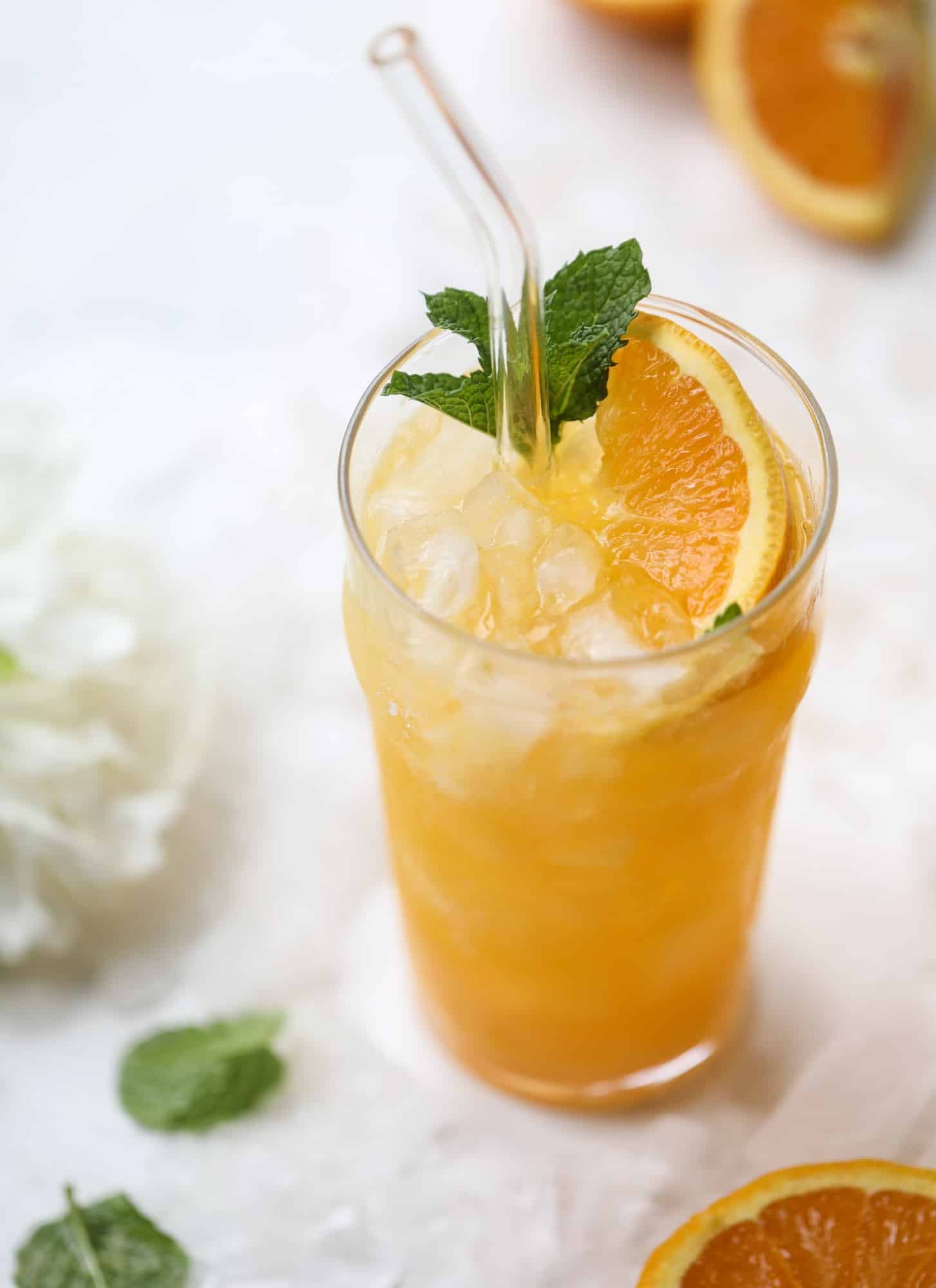 This orange crush is a copycat cocktail from the ones served in Ocean City, Maryland at the beach all summer long! It's one entire freshly squeezed orange with vodka and lemon lime soda and it tastes like heaven. Super refreshing and perfect for summer. I howsweeteats.com #orange #crush #cocktail #ocean #city #vodka