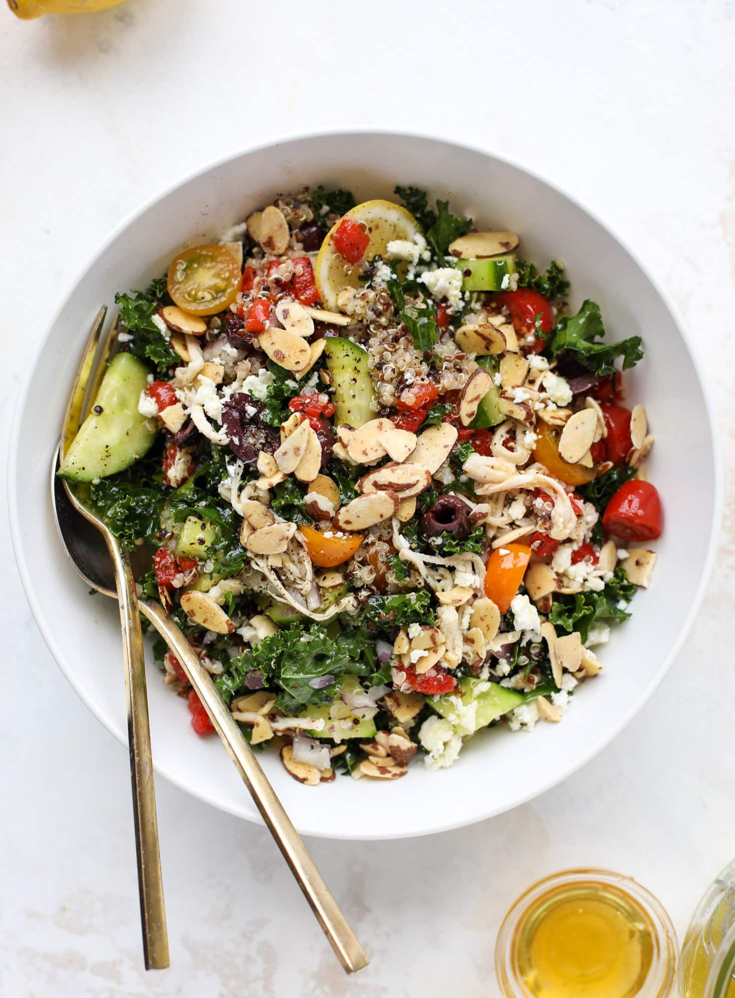 This mediterranean kale and quinoa salad is a copycat for the delicious Panera Bread Modern Greek Salad with Chicken. Super easy and satisfying! I howsweeteats.com #mediterranean #kalesalad