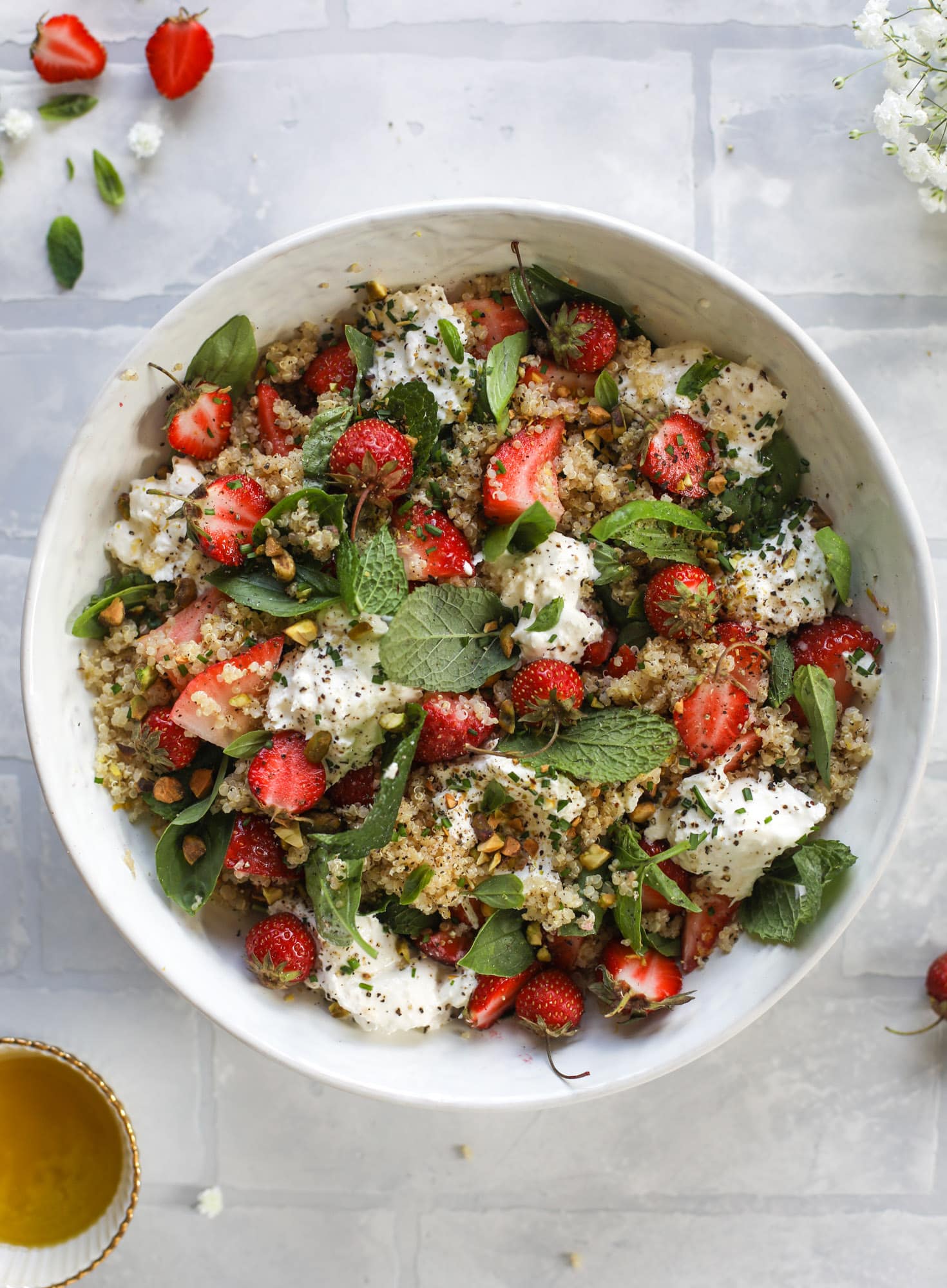 This strawberry quinoa salad is loaded with fresh herbs, burrata cheese and chopped pistachios. Topped with a lemon dressing, it's heavenly! 