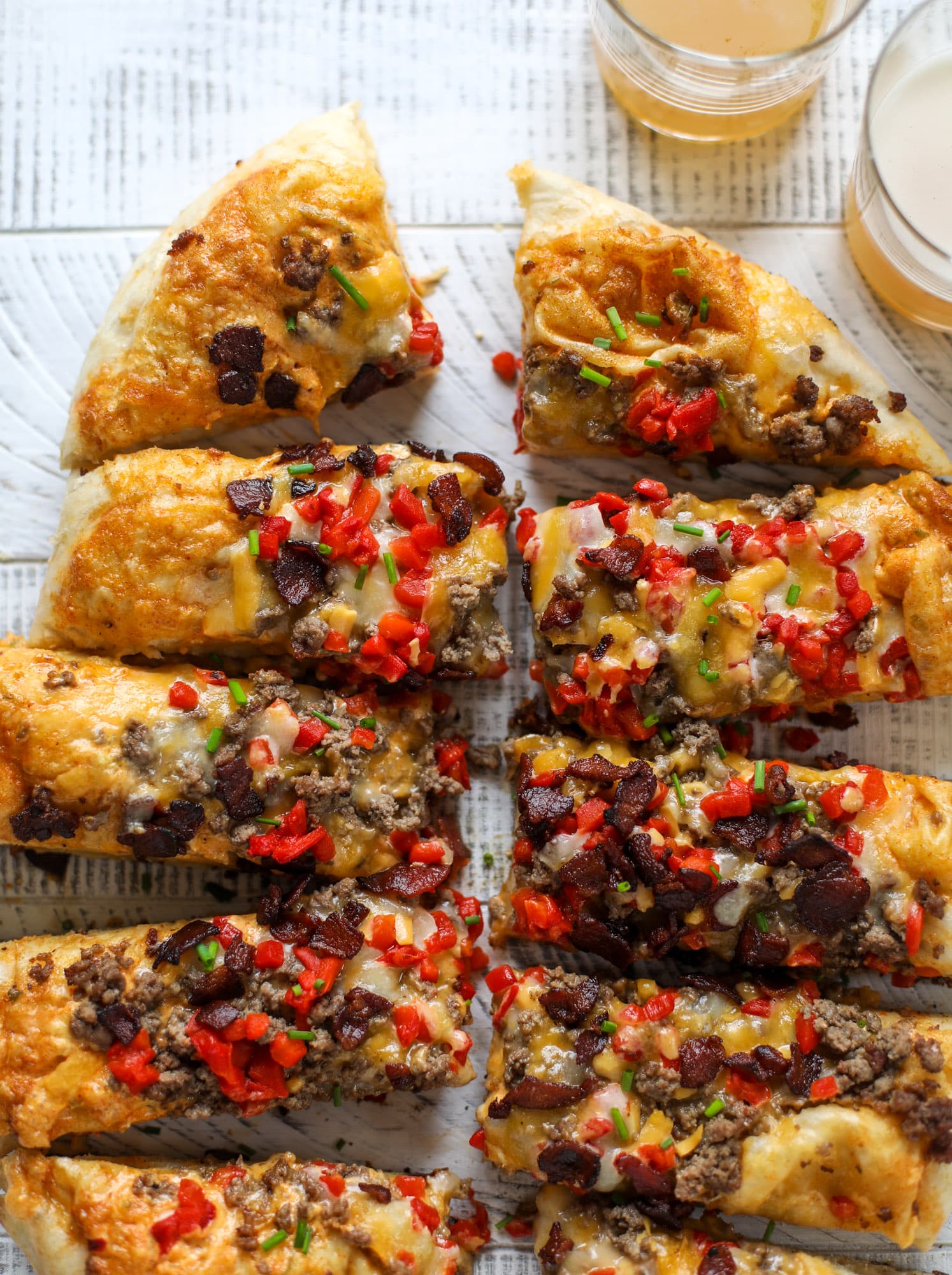 This grilled cheeseburger pizza is my take on the smoke shack burger! Cheddar, bacon, cherry peppers and special sauce make this impossible to resist.