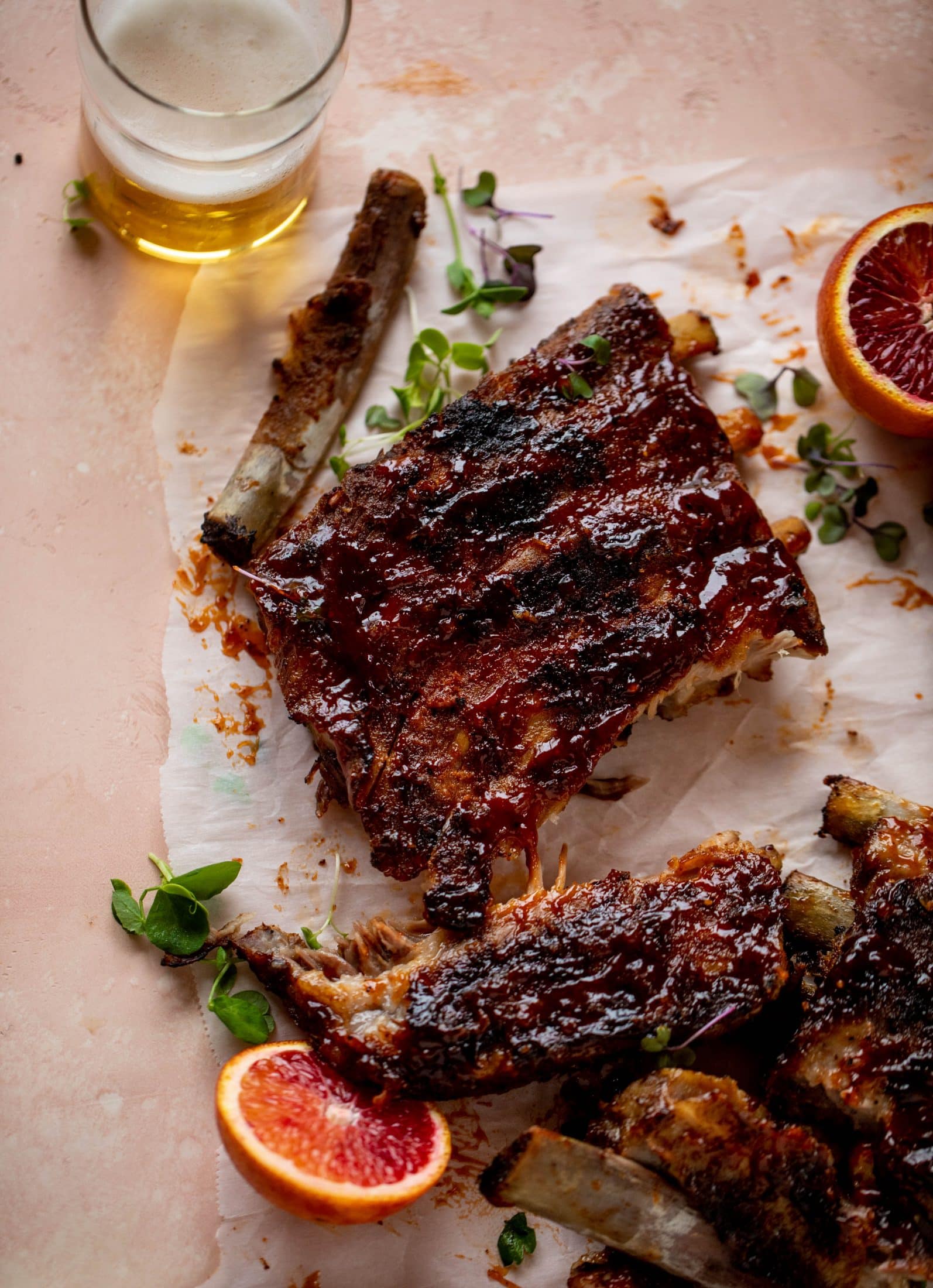 These blood orange BBQ ribs are smoky, sweet, sticky and oh-so good. Serve alongside an avocado butter greens salad for the ultimate combo!