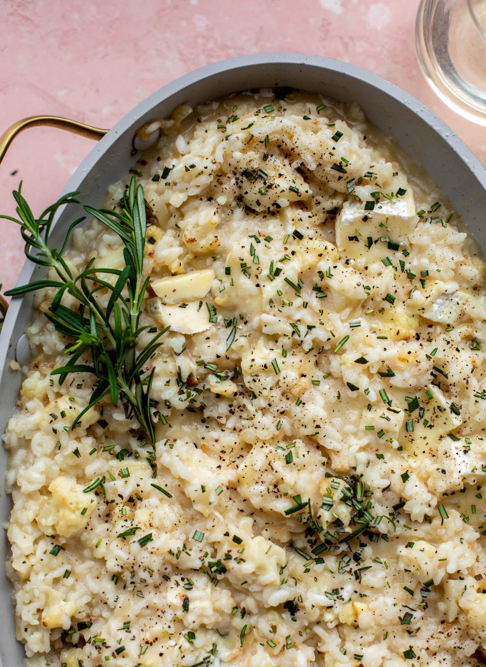This baked risotto is delicious and so much easier than the stovetop version! Toasted cauliflower, brie cheese and rosemary make this taste incredible.