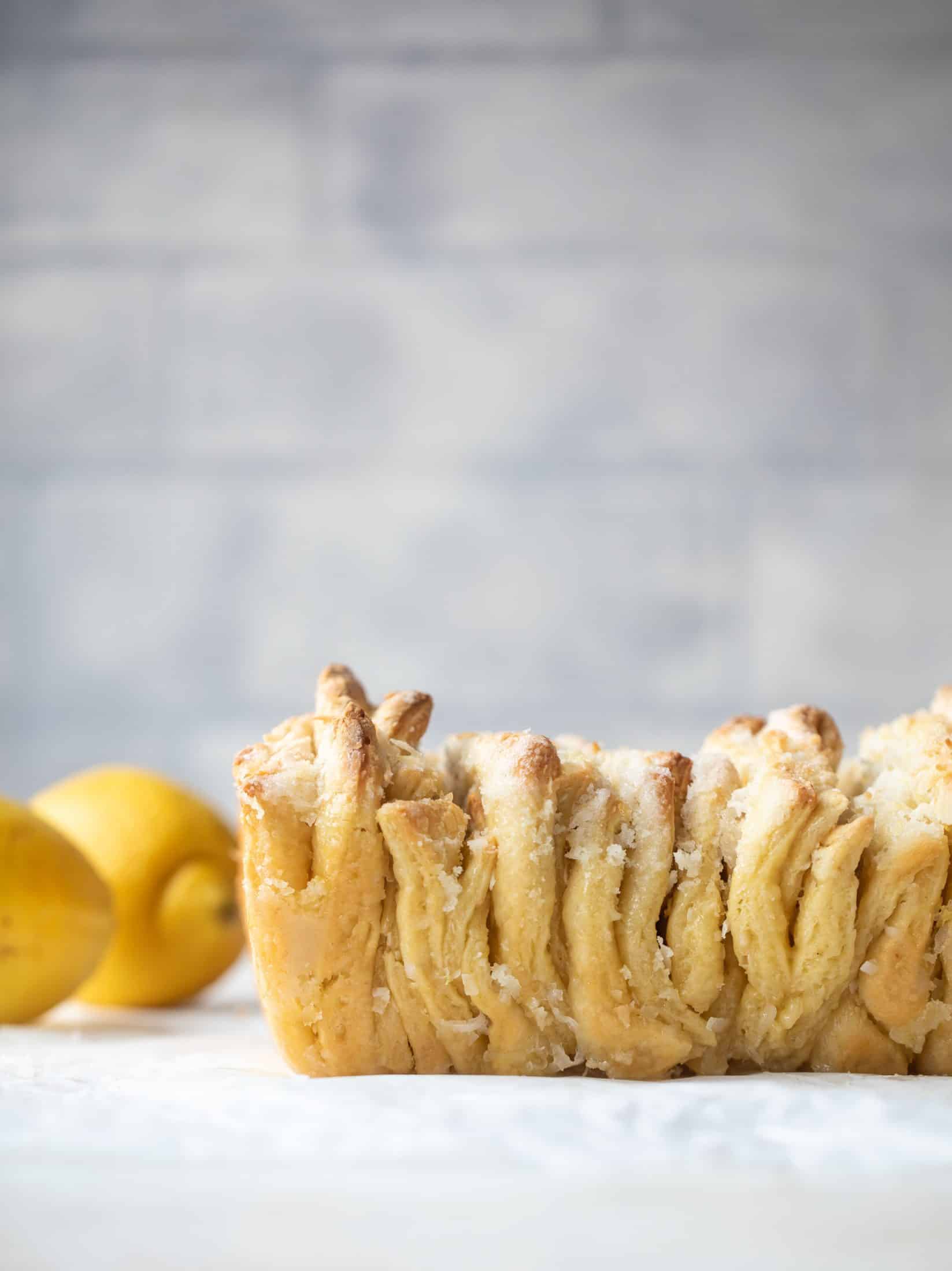 This lemon coconut bread is a pull apart dream! It's perfect for brunch or dessert with the perfect amount of fluffiness.