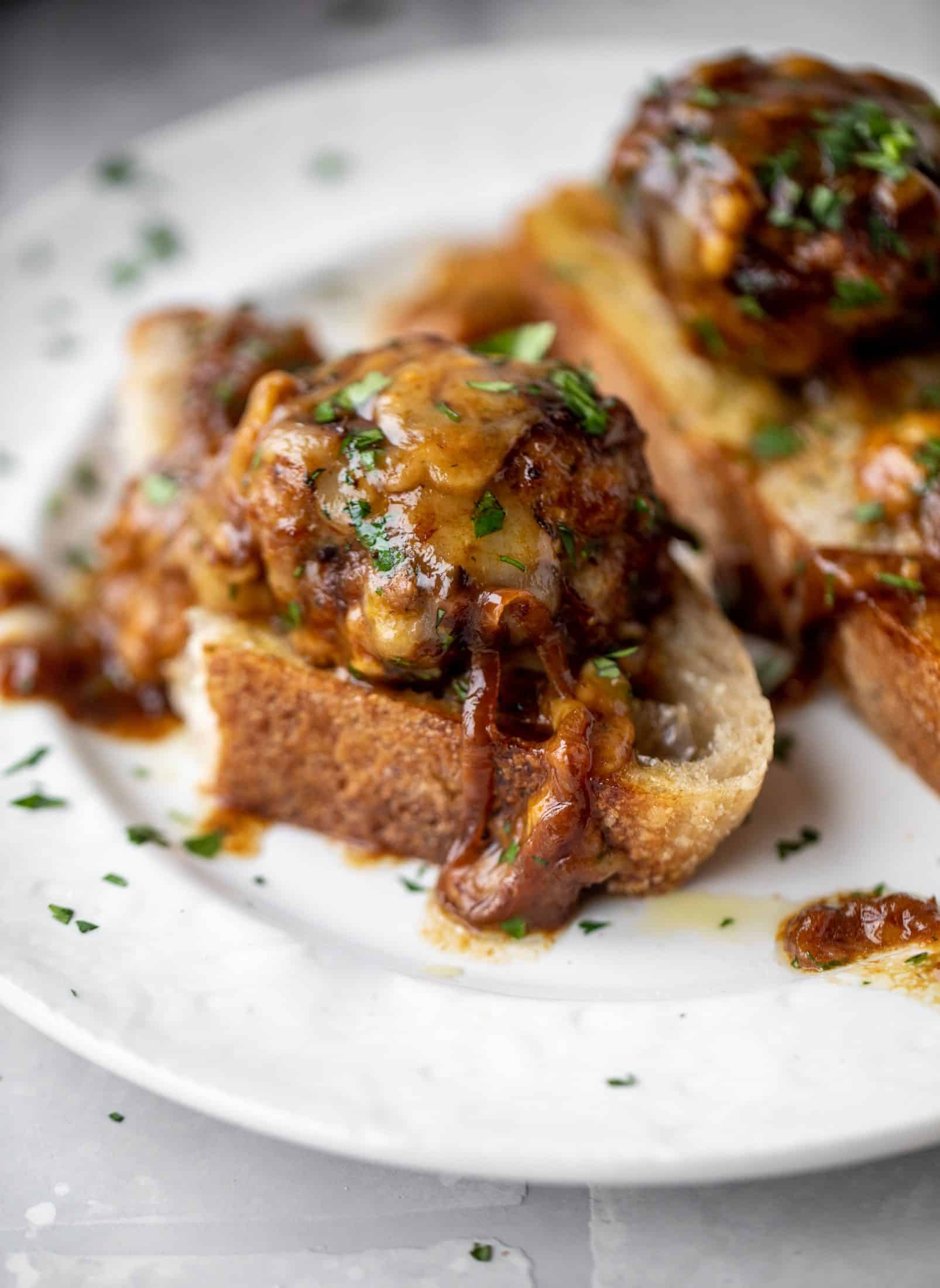 These french onion meatballs are super delicious! All the flavors of french onion soup made into juicy meatballs. Cheesy, saucy goodness!