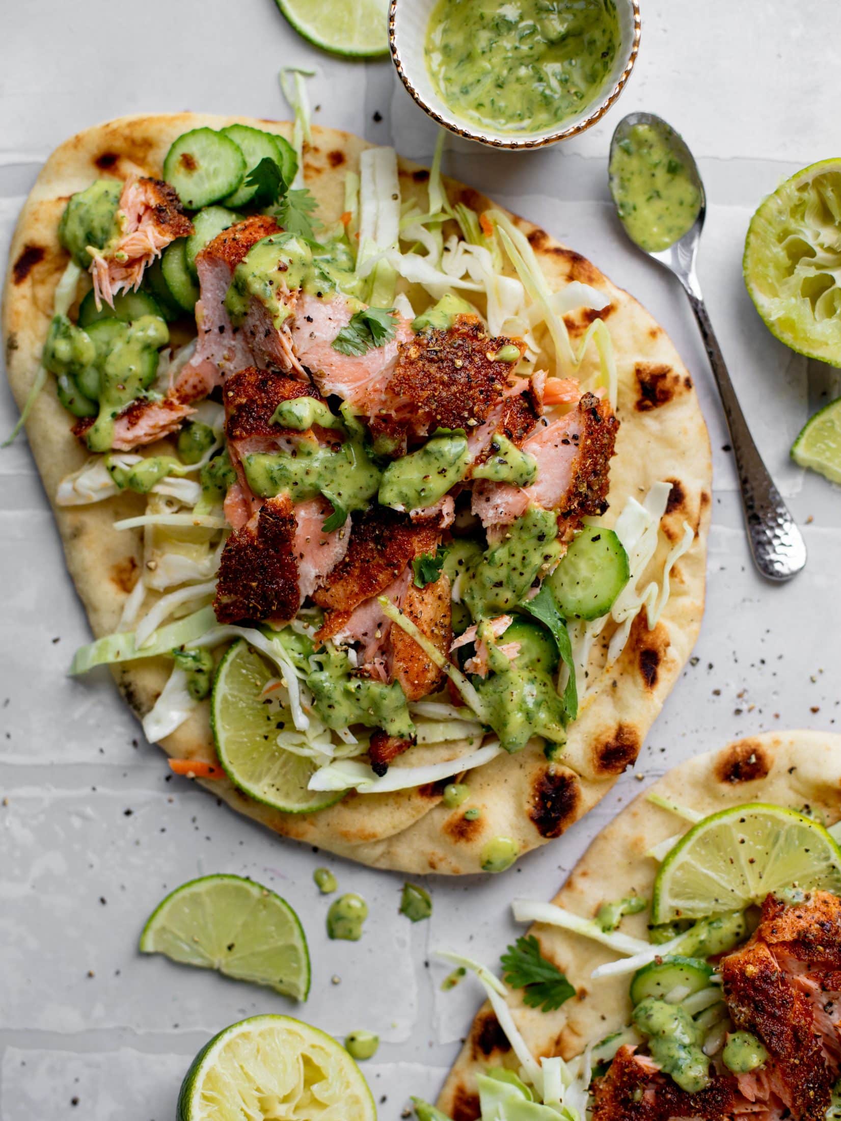 grilled salmon on naan bread with slaw and cilantro sauce