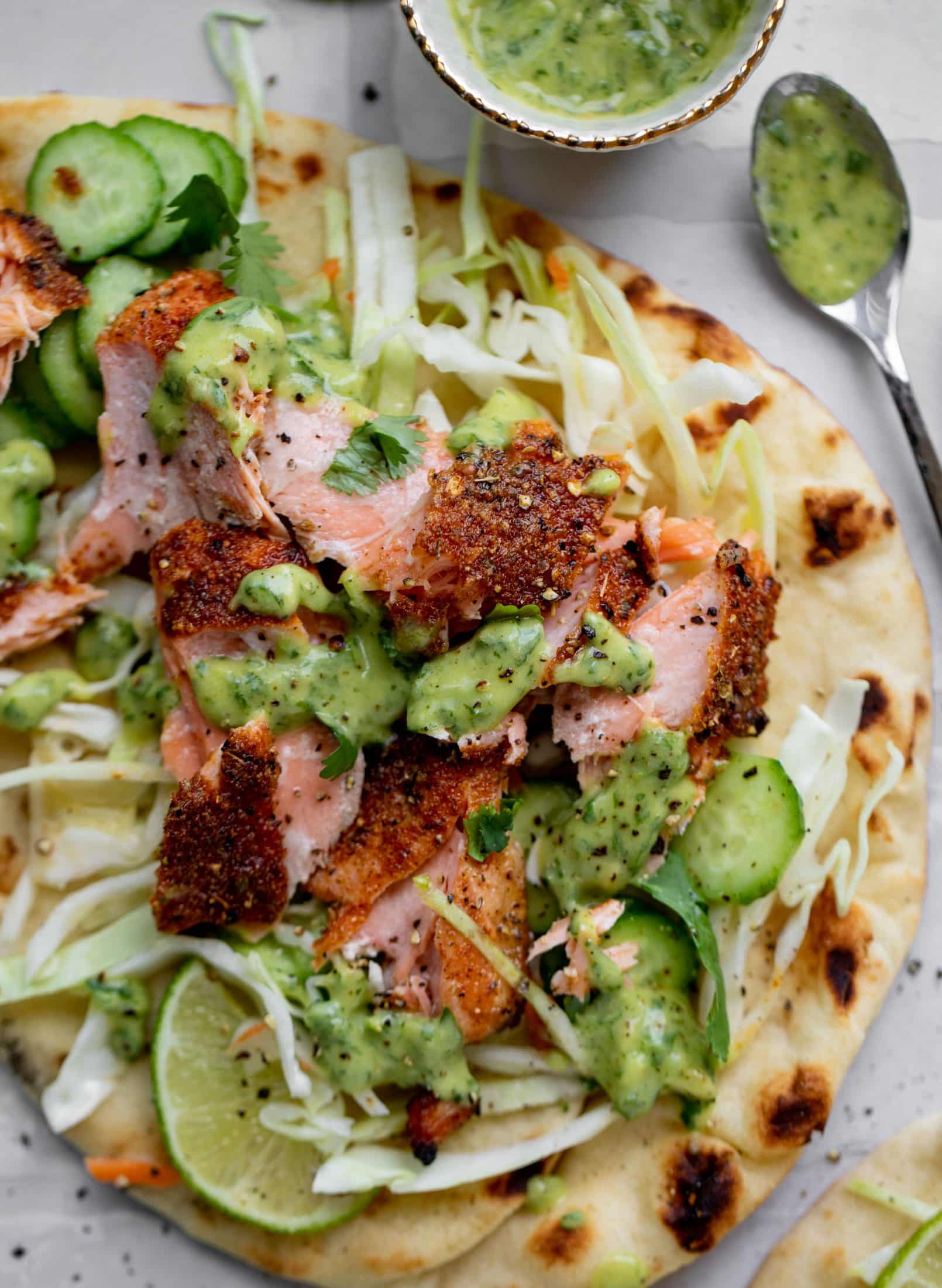 grilled salmon on naan bread with slaw and cilantro sauce