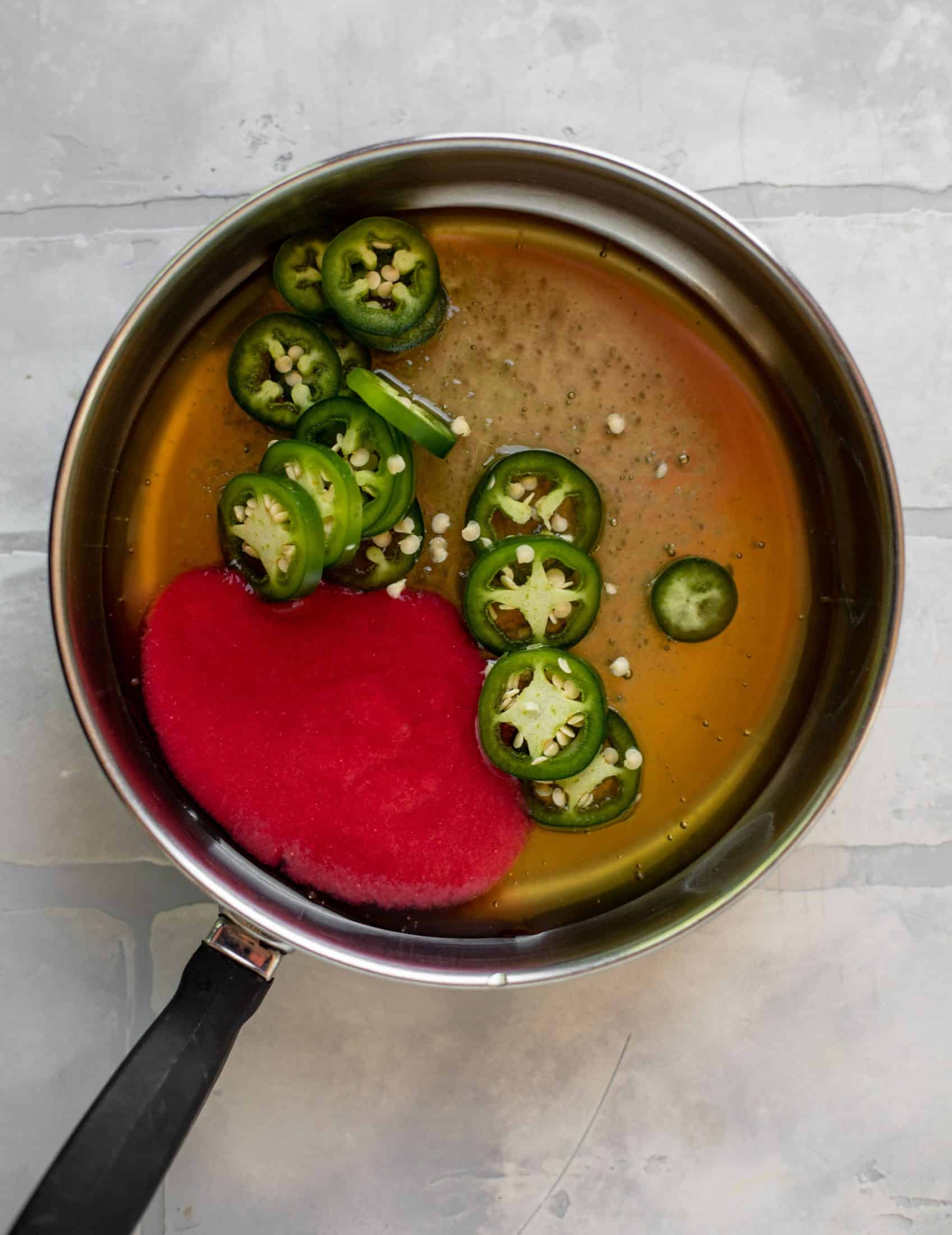 raspberry puree and jalapeno in honey