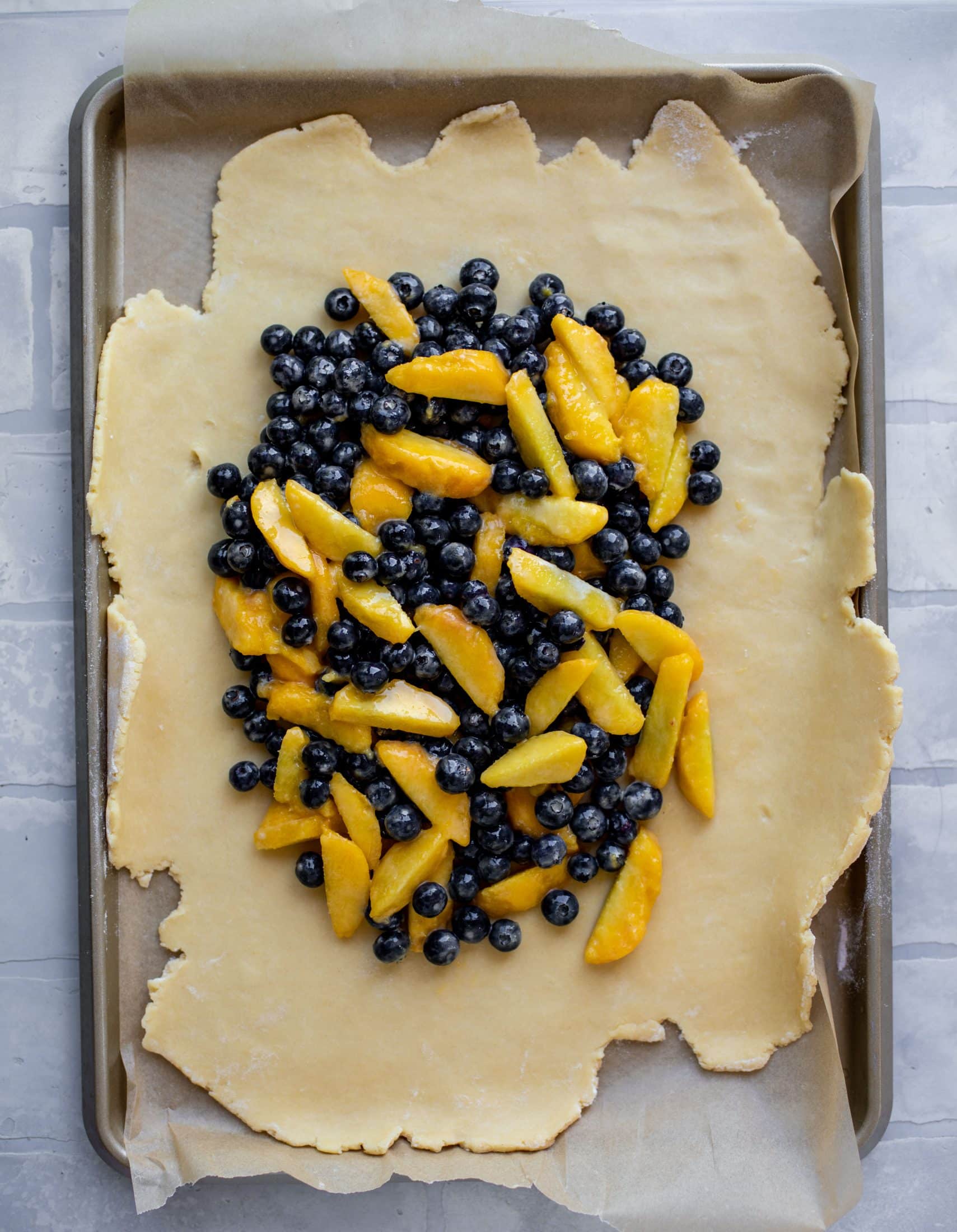 blueberries and peaches in galette dough