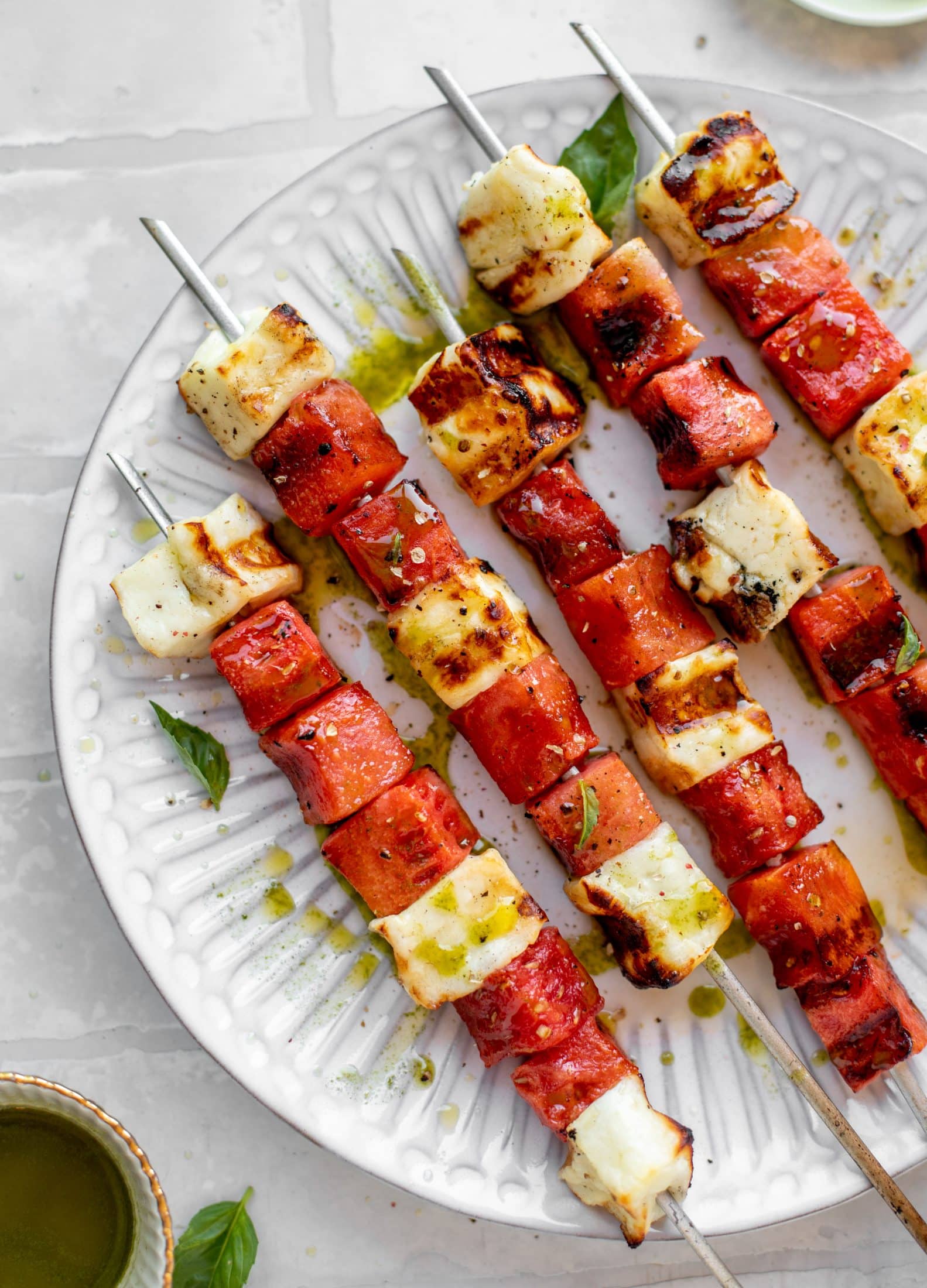 grilled watermelon halloumi skewers with mint basil oil