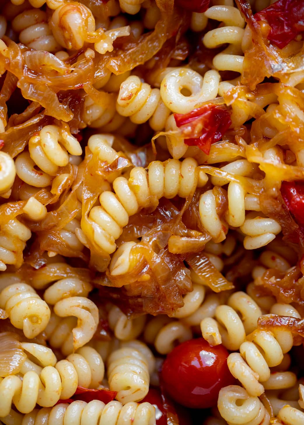 caramelized onion burst tomato pasta up close