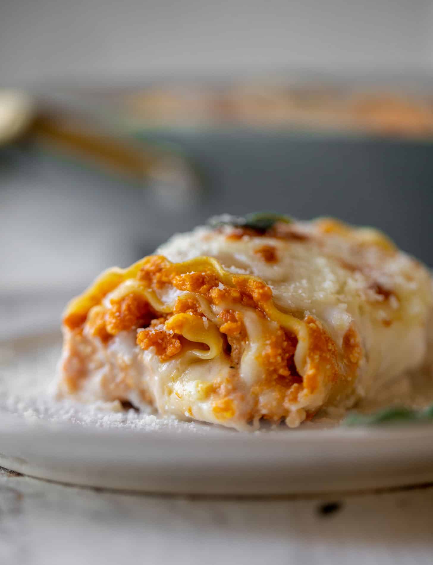 pumpkin lasagna roll ups with crispy sage head on shot