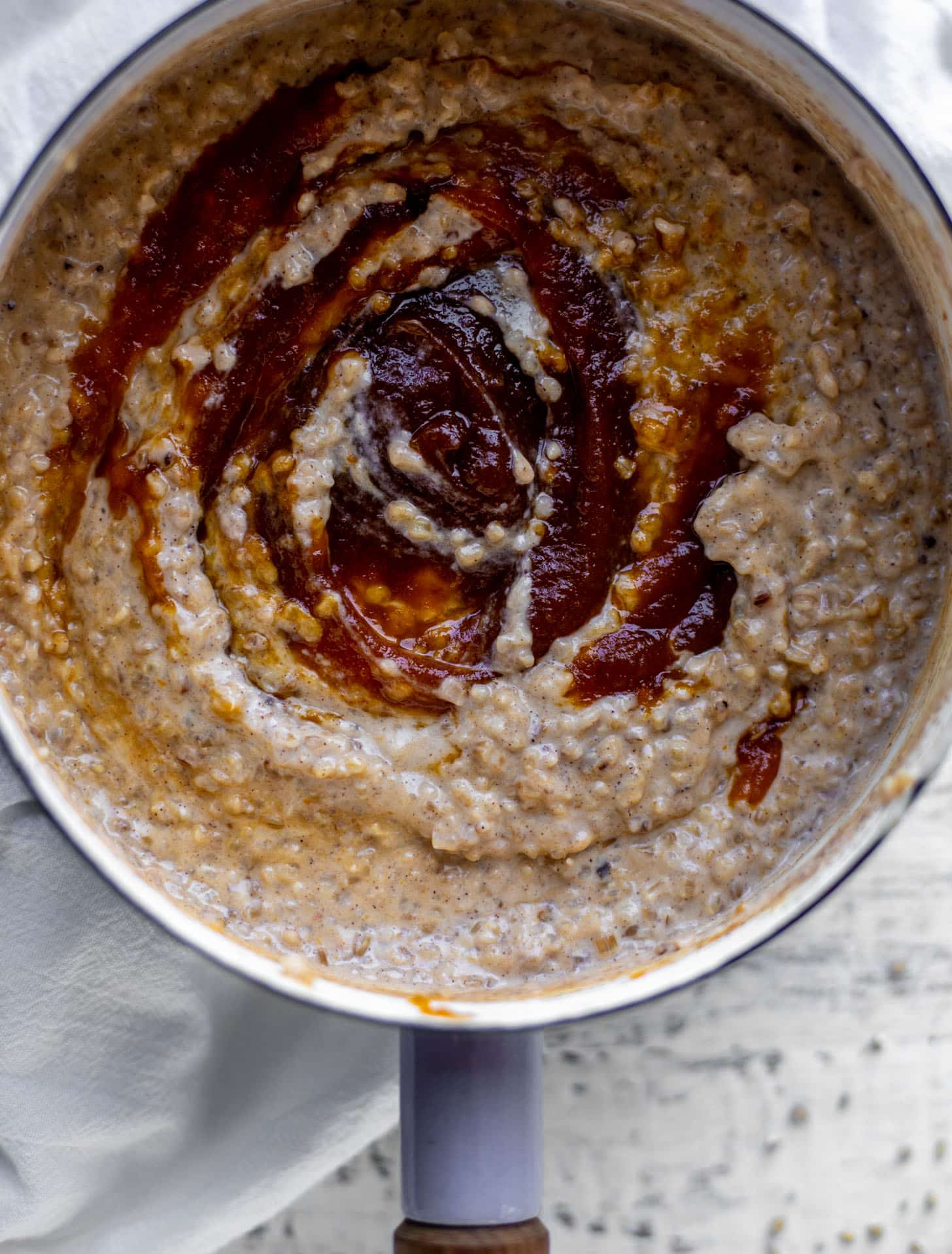 swirling pumpkin butter in pumpkin pie oatmeal