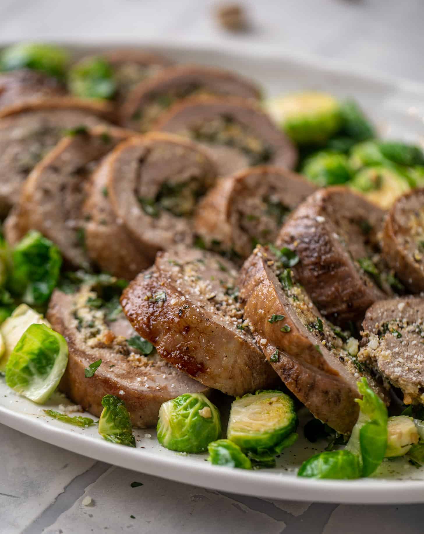 parmesan pistachio stuffed pork tenderloin with brussels sprouts