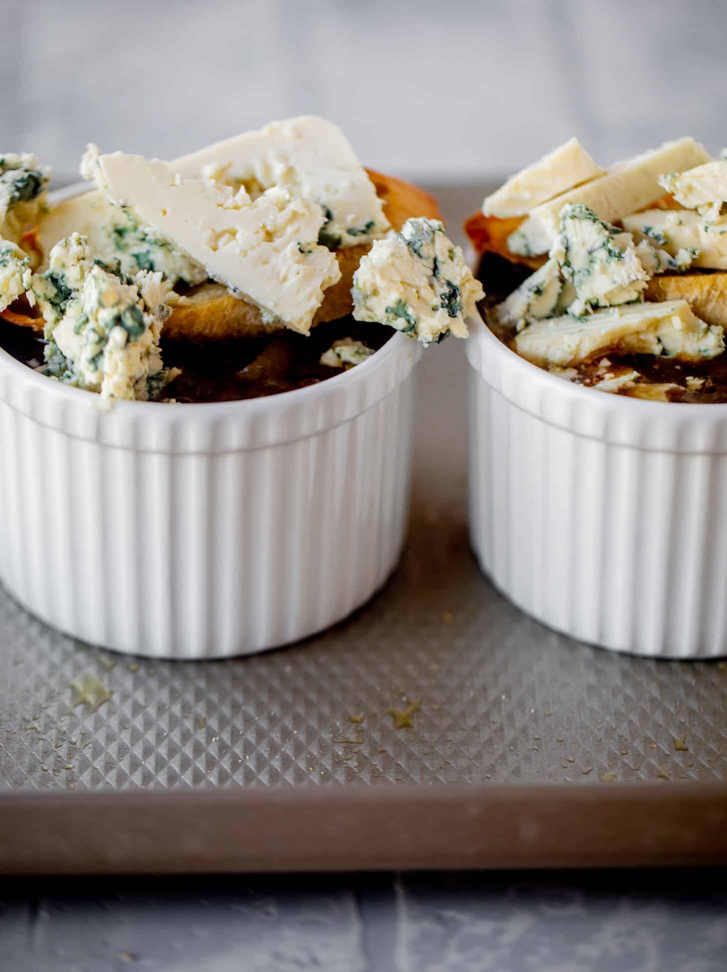 french onion soup topped with baguettes and blue cheese