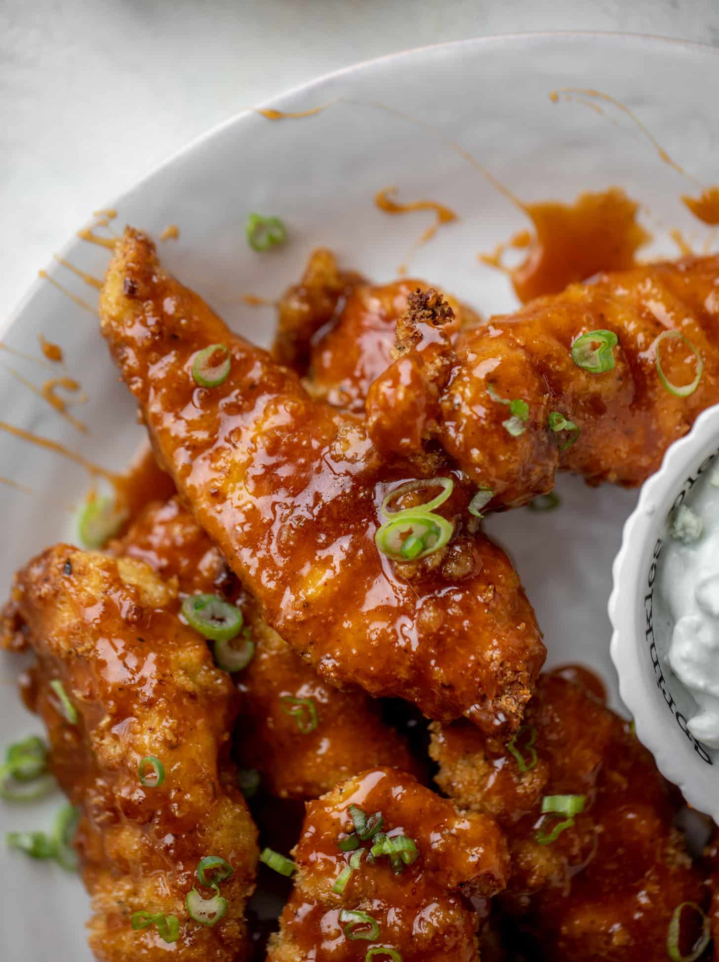 sticky chicken fingers with yogurt blue cheese sauce
