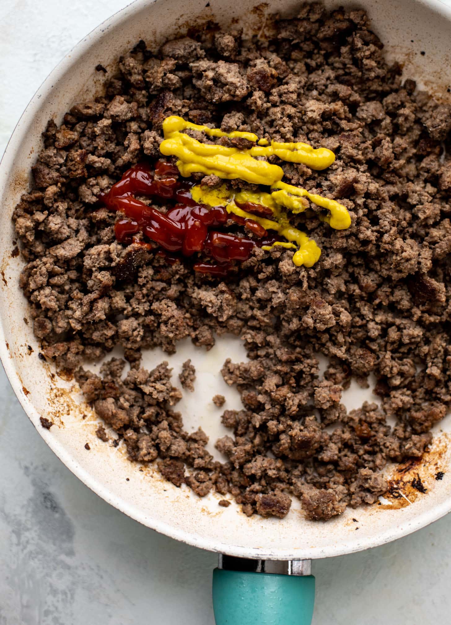 ground beef with ketchup and mustard