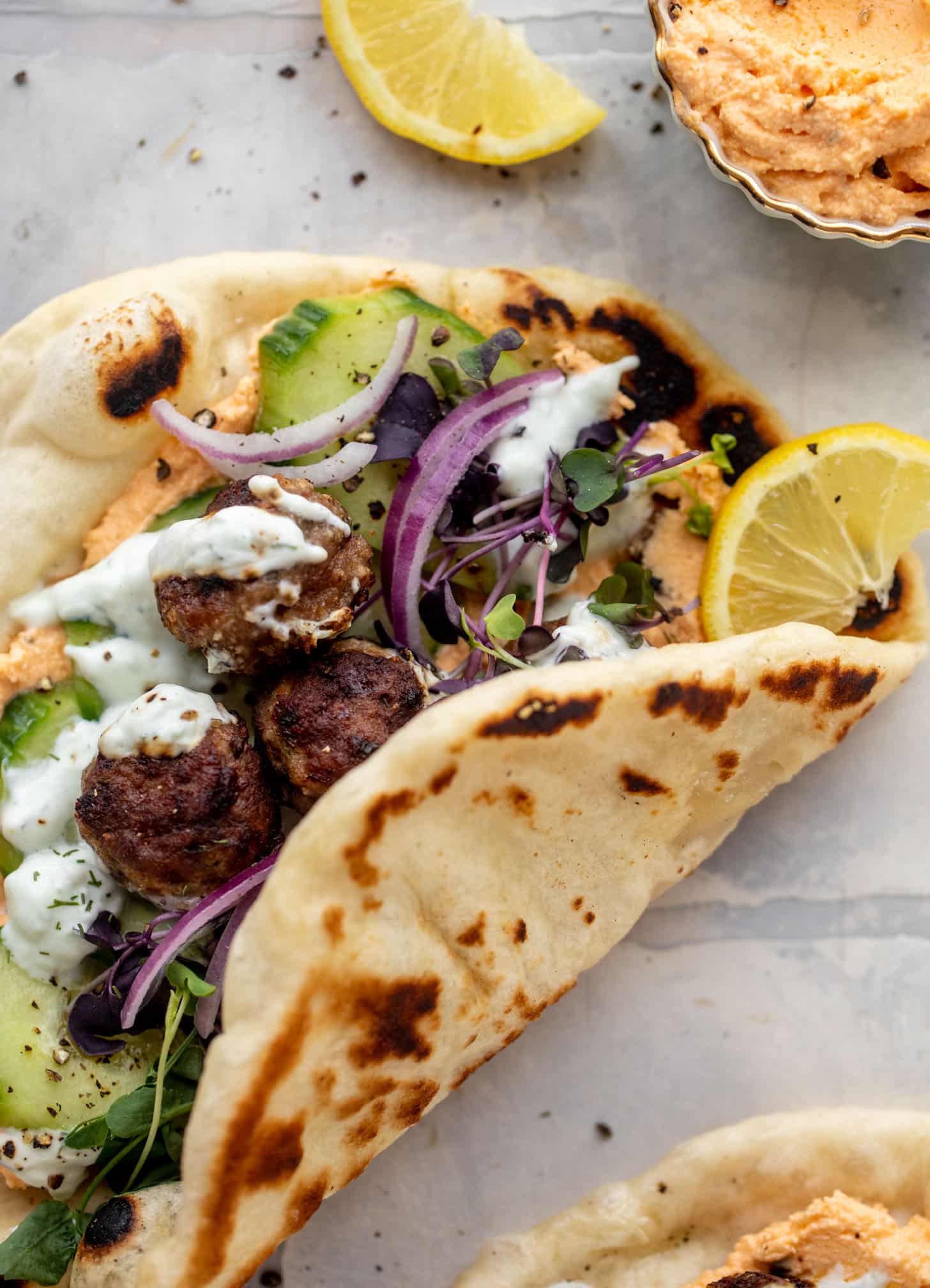 chicken meatball pitas with roasted red pepper whipped feta