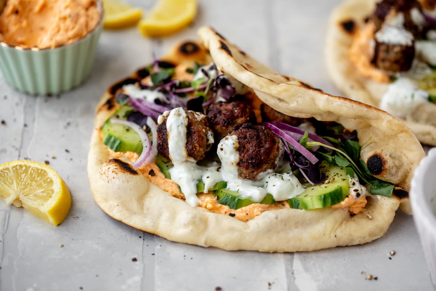 chicken meatball pitas with roasted red pepper whipped feta