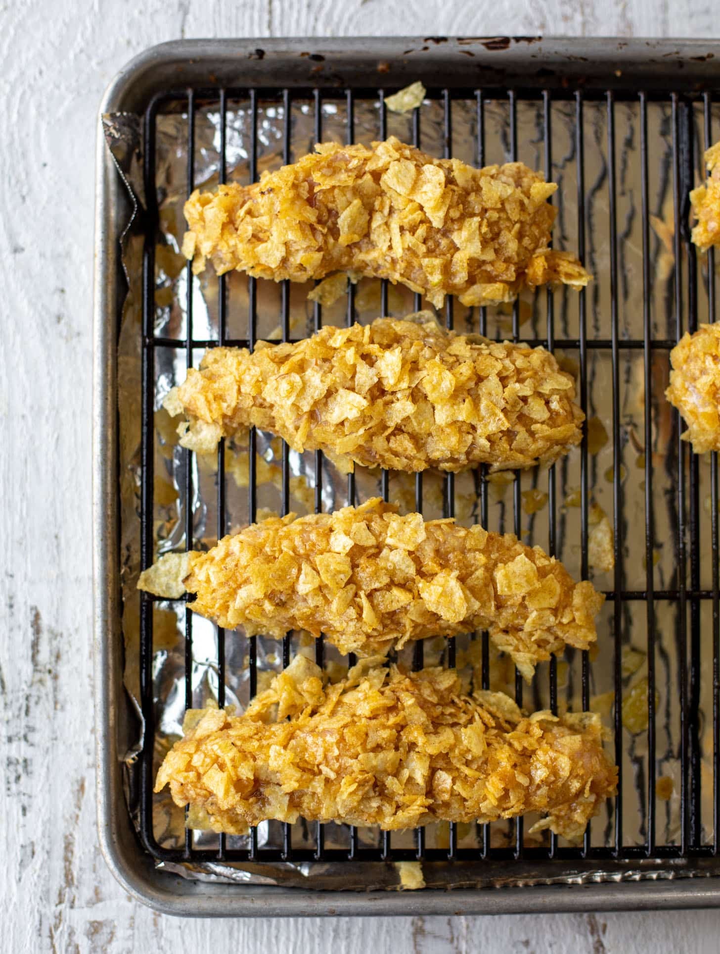 potato chip crusted chicken fingers ready to bake