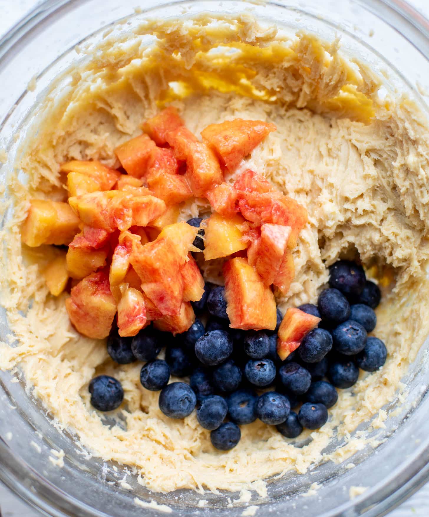 cake batter with blueberries and peaches