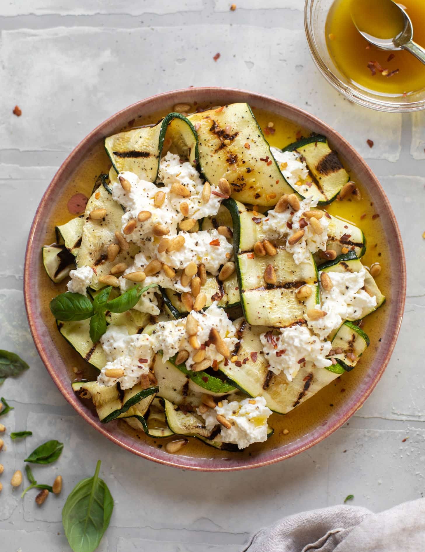 grilled zucchini with burrata and pine nuts