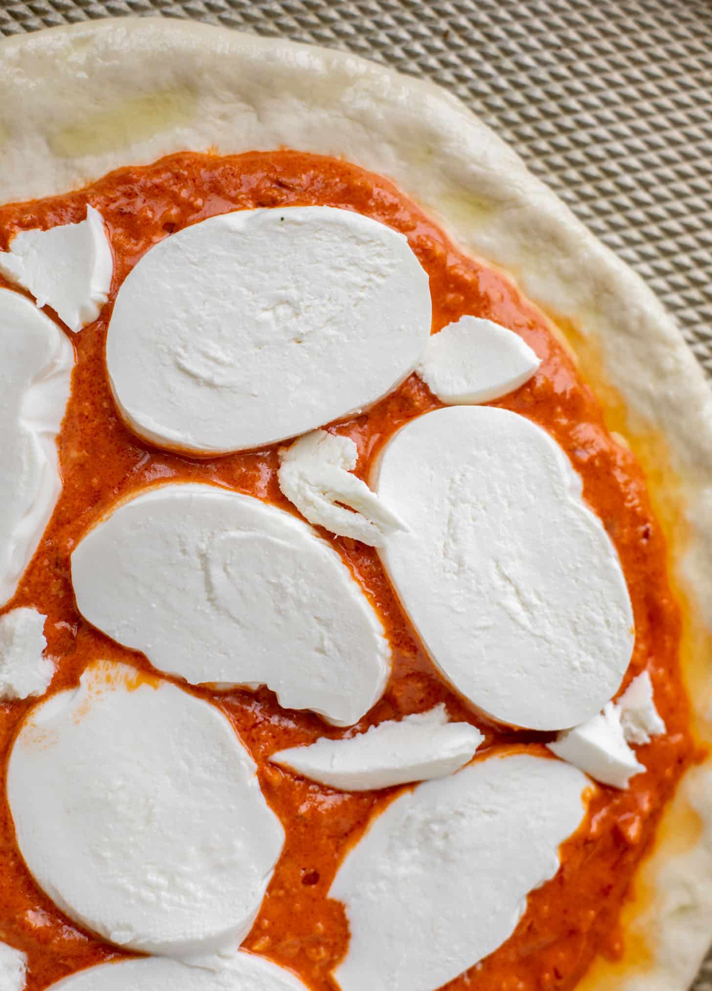 dough with sauce and cheese