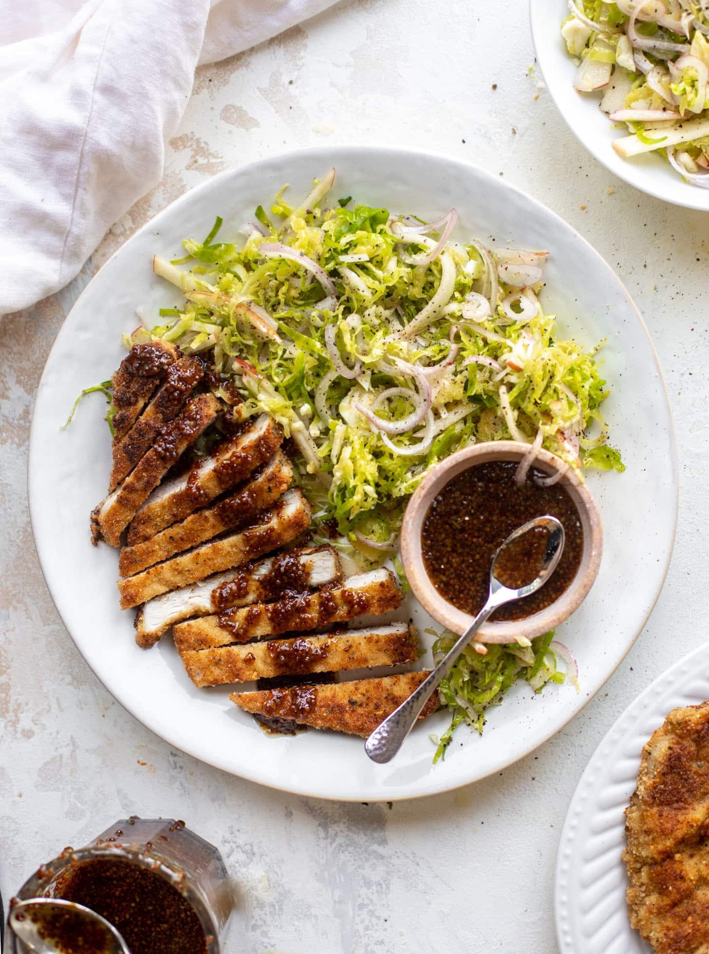 pork schnitzel with carolina gold BBQ sauce & brussels sprouts slaw