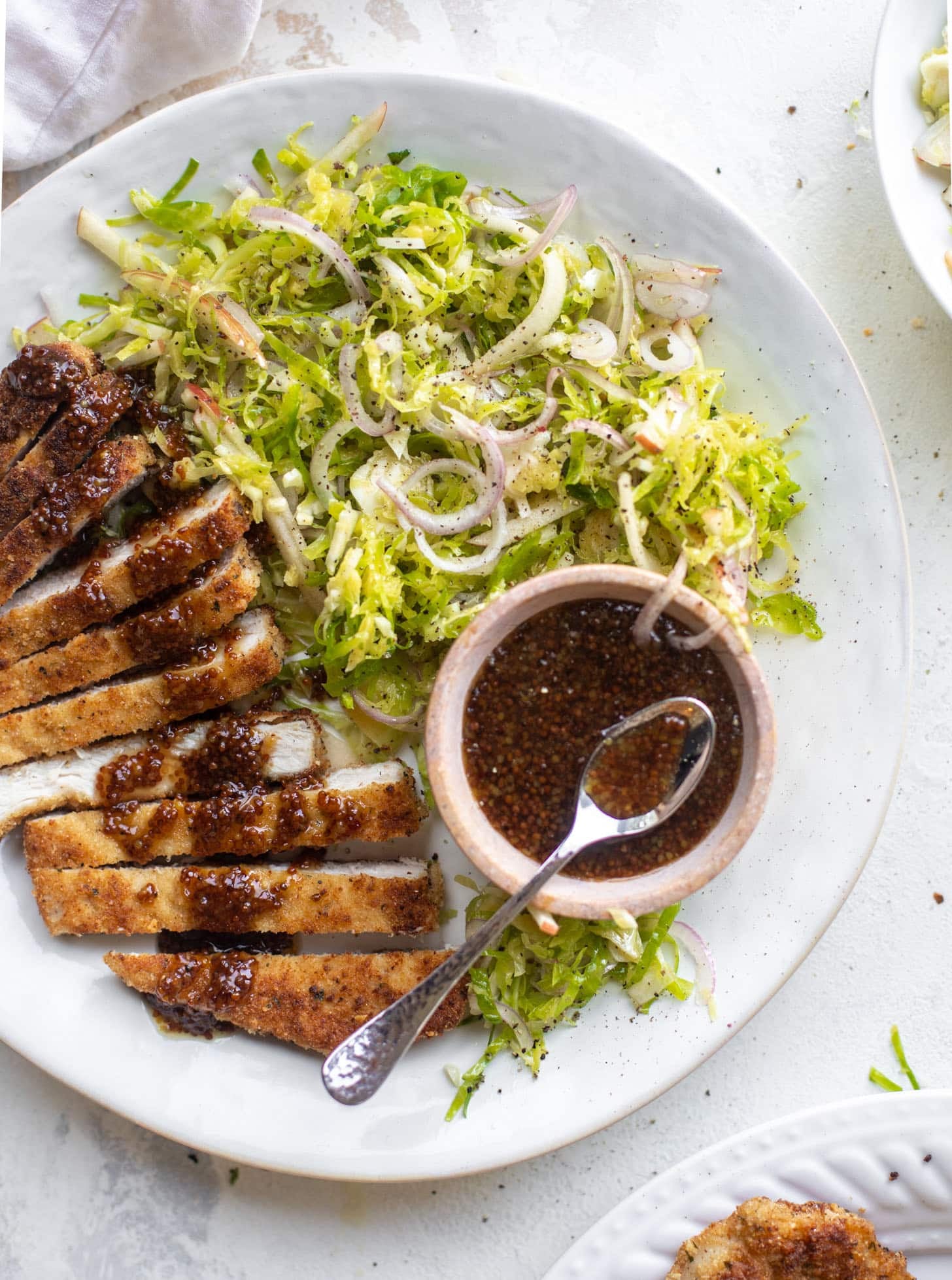 pork schnitzel with carolina gold BBQ sauce & brussels sprouts slaw