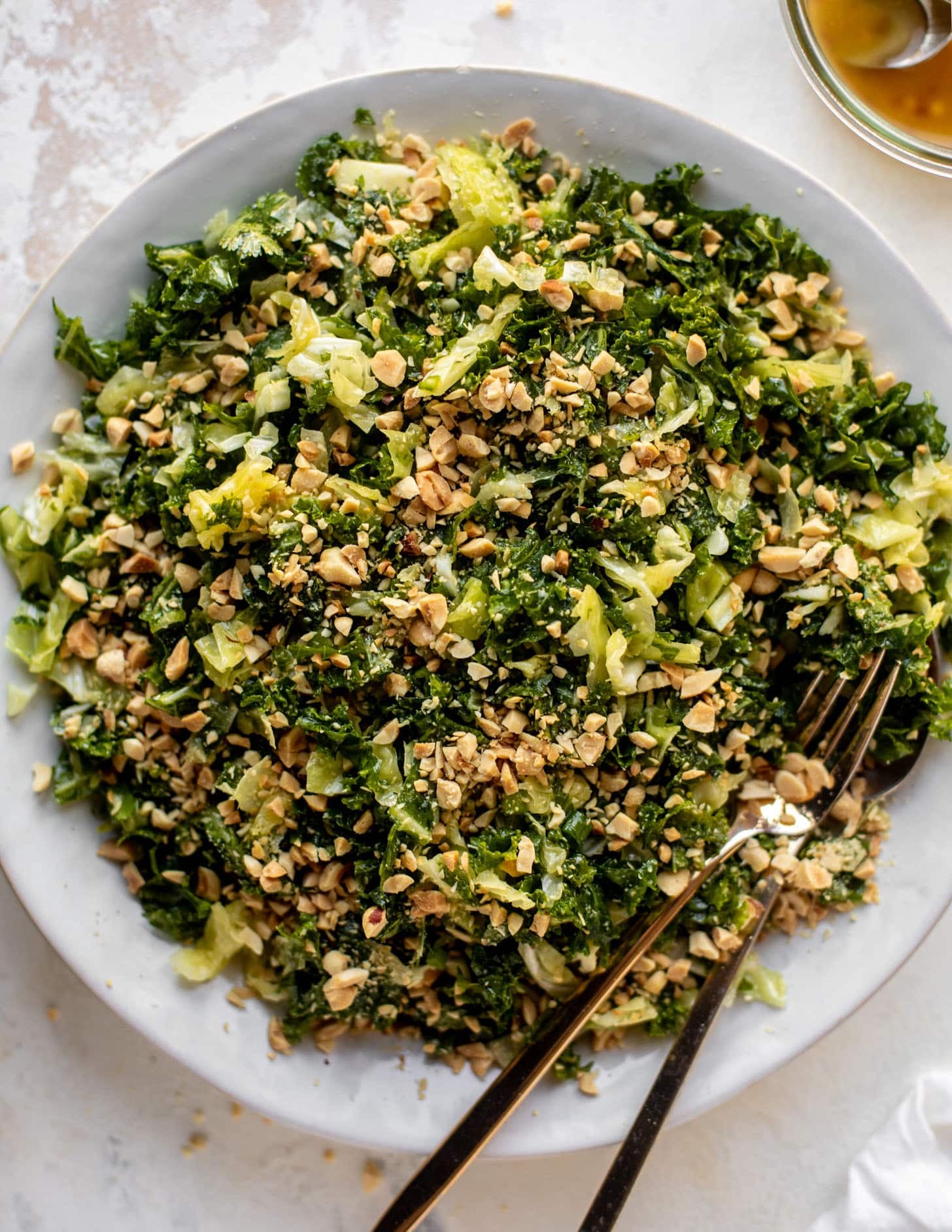 crunchy emerald kale salad with peanut vinaigrette