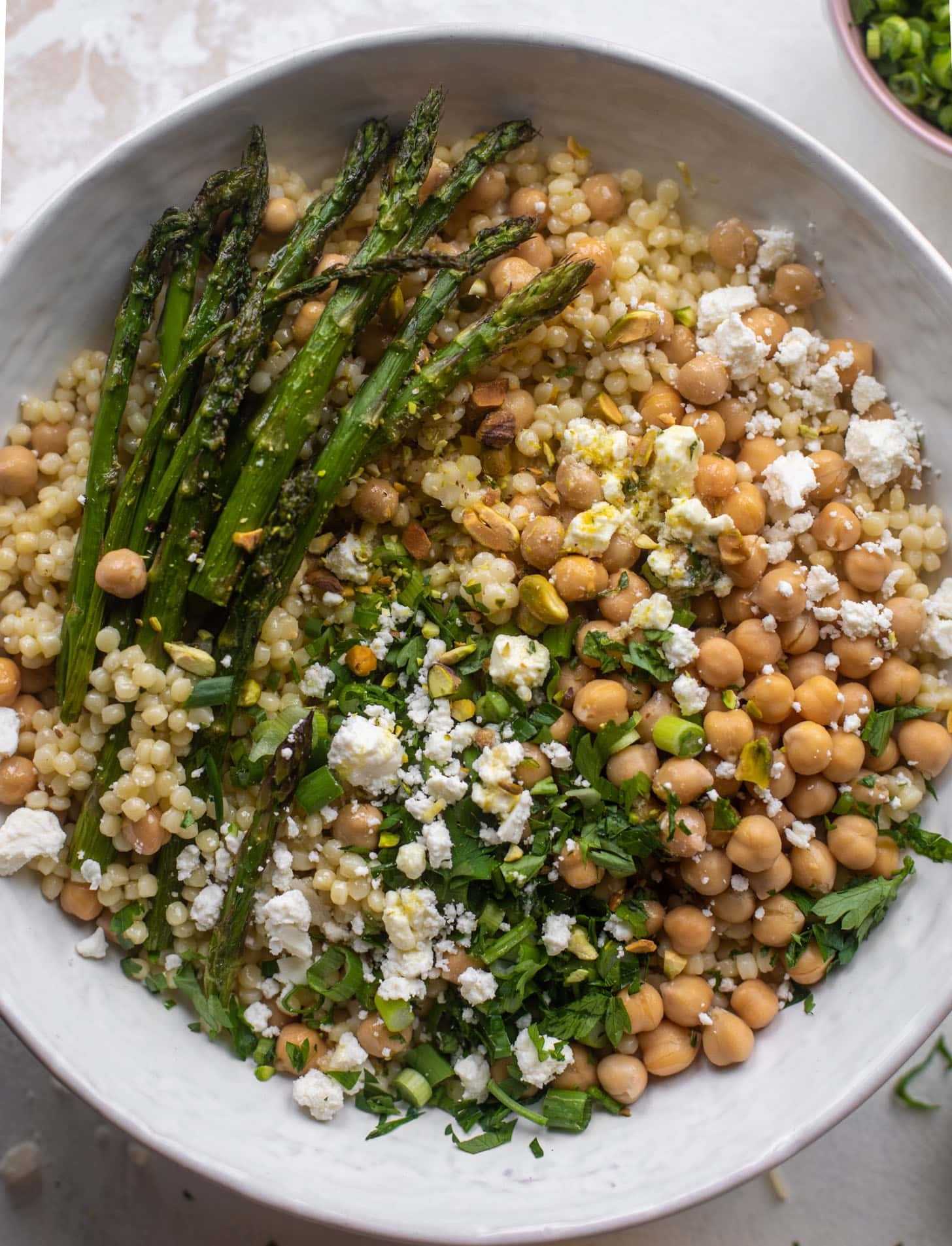spring couscous bowls with lemon feta vinaigrette