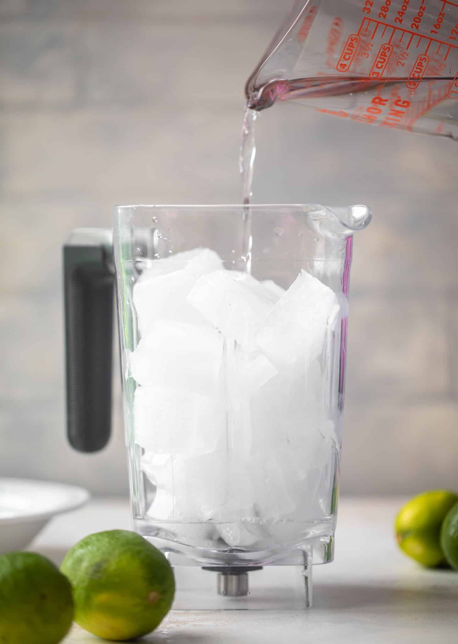 pouring gin in the blender