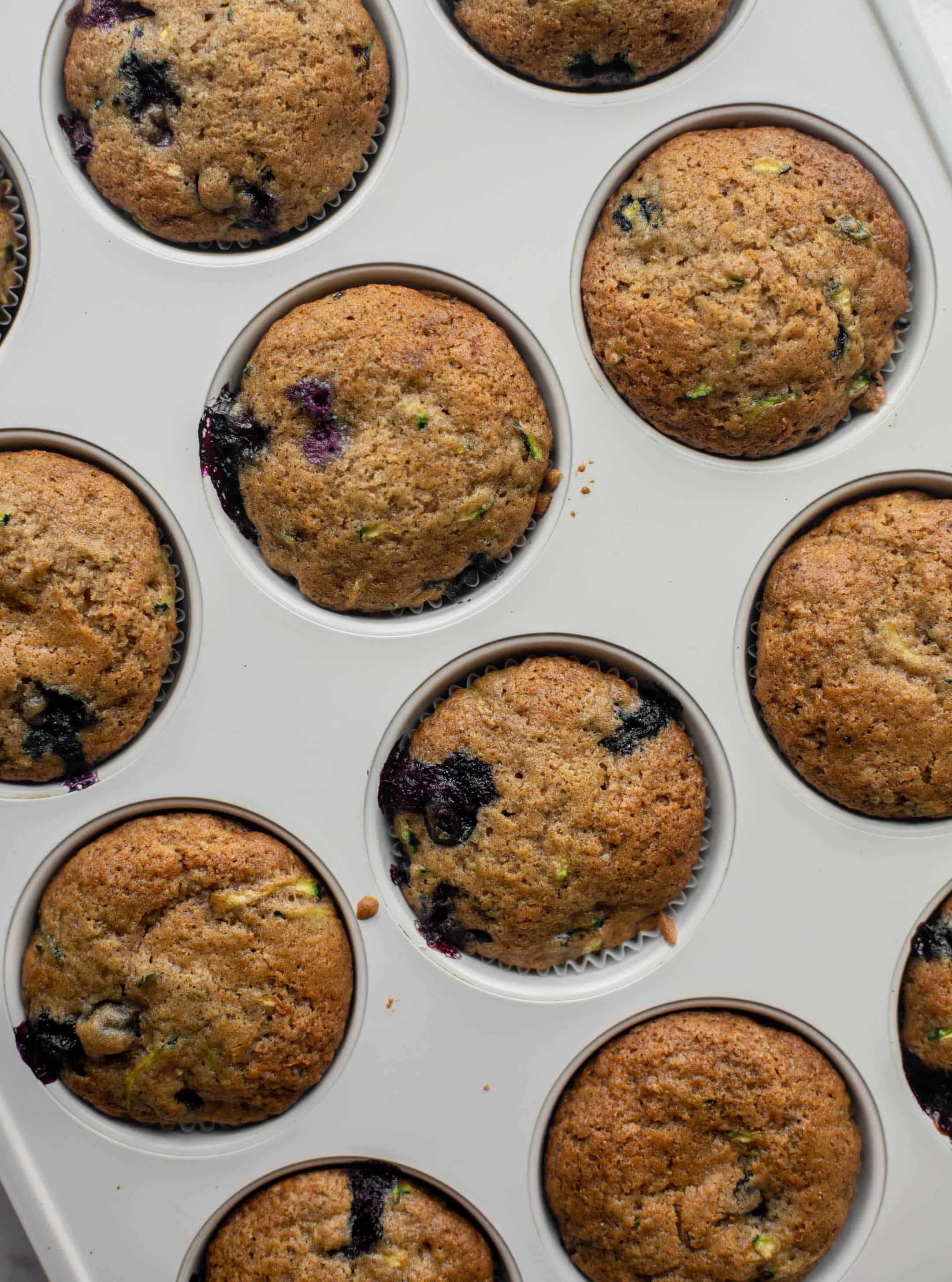 blueberry zucchini muffins with lemon glaze