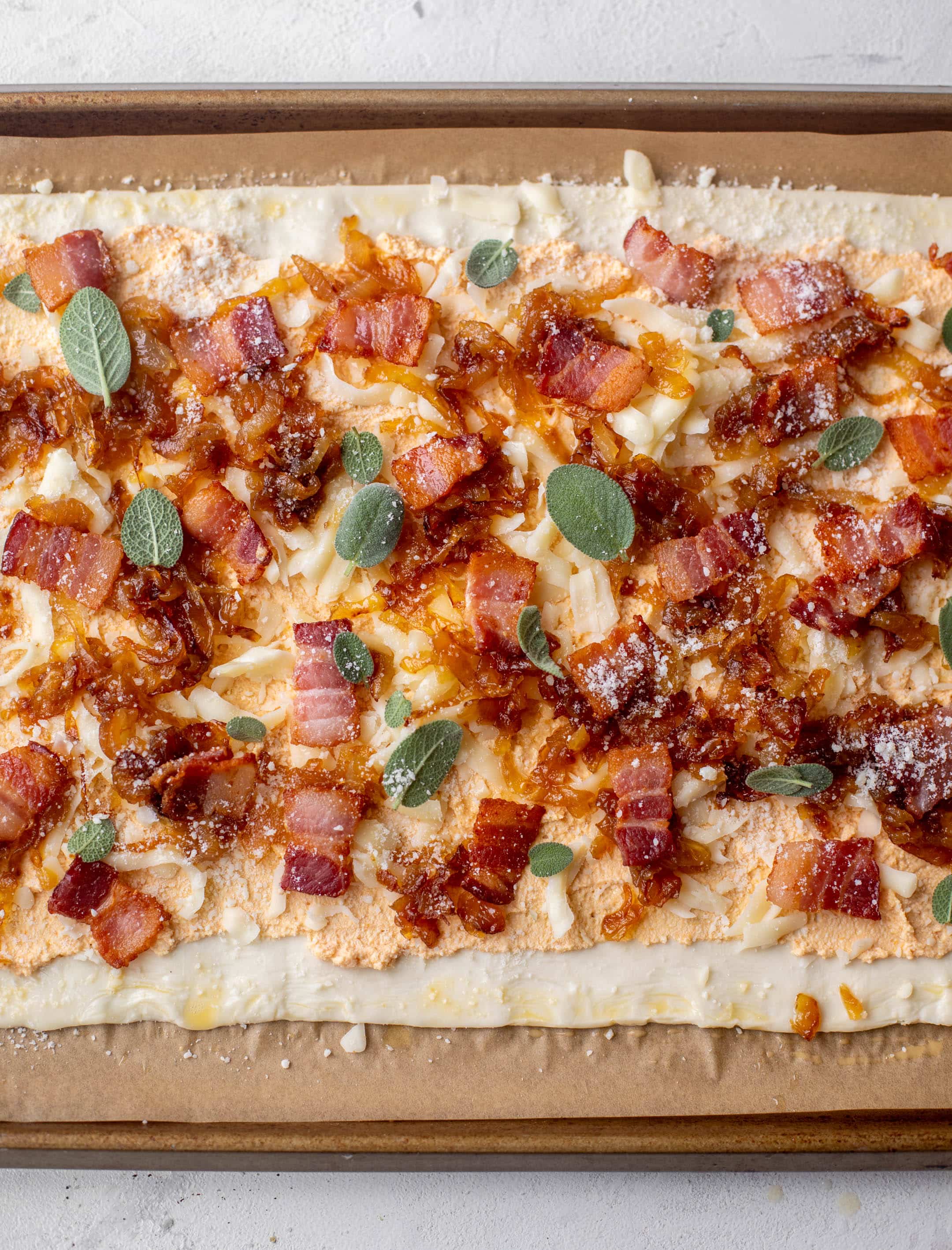 savory pumpkin puff pastry pizza ready for the oven