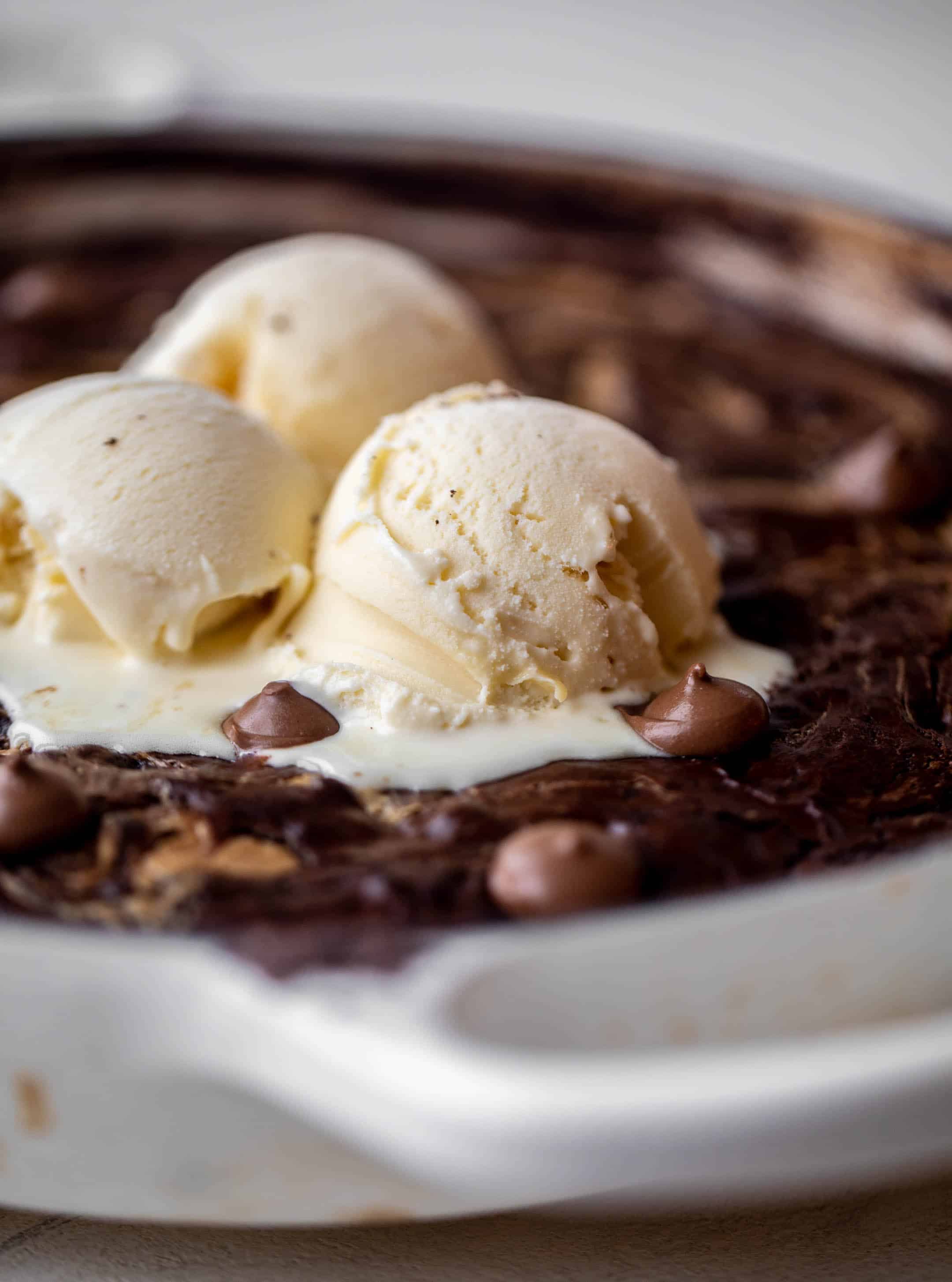 ice cream melting on chocolate peanut butter skillet brownie