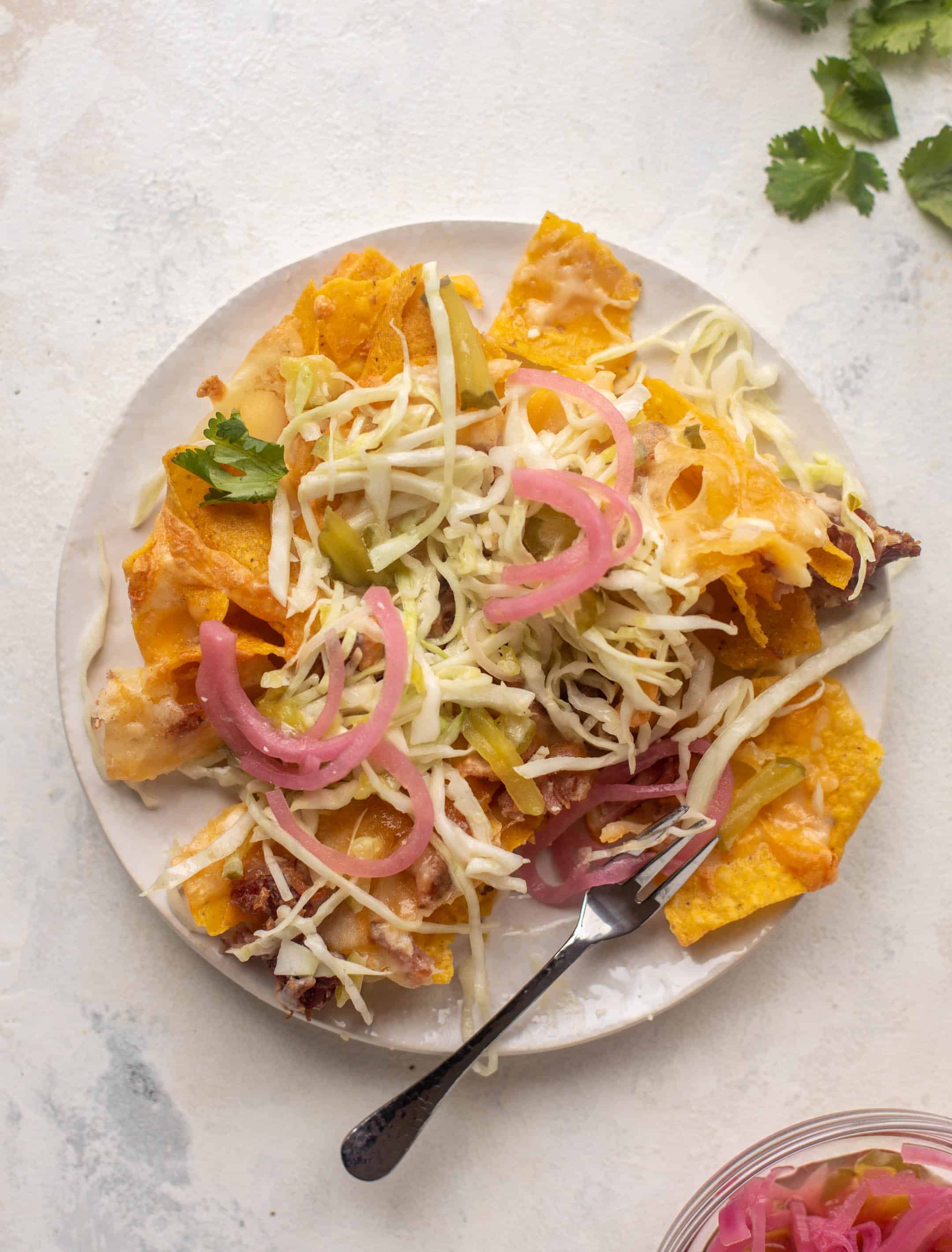 pulled pork nachos with pickle slaw