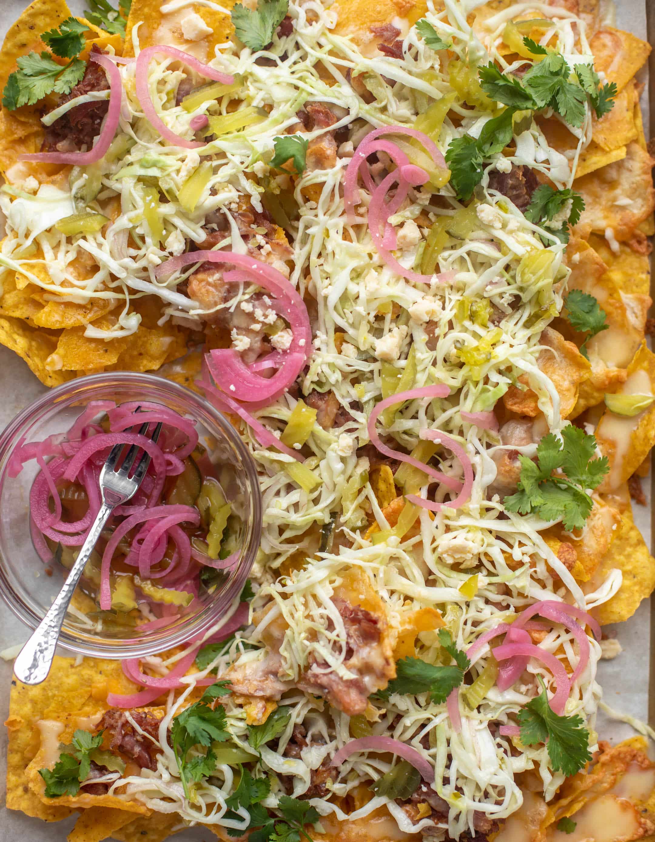 pulled pork nachos with pickle slaw