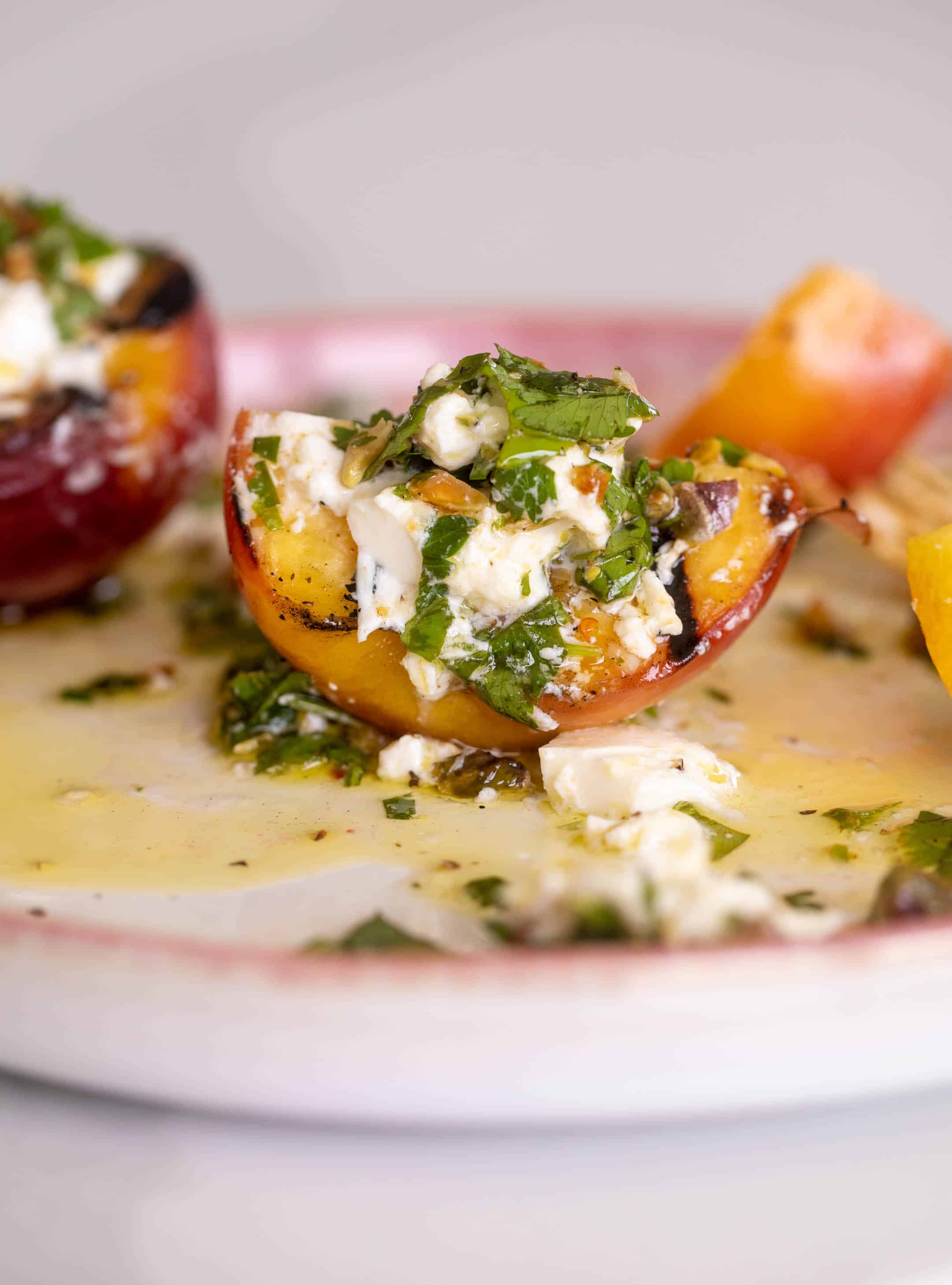 grilled peaches with burrata and pistachio vinaigrette