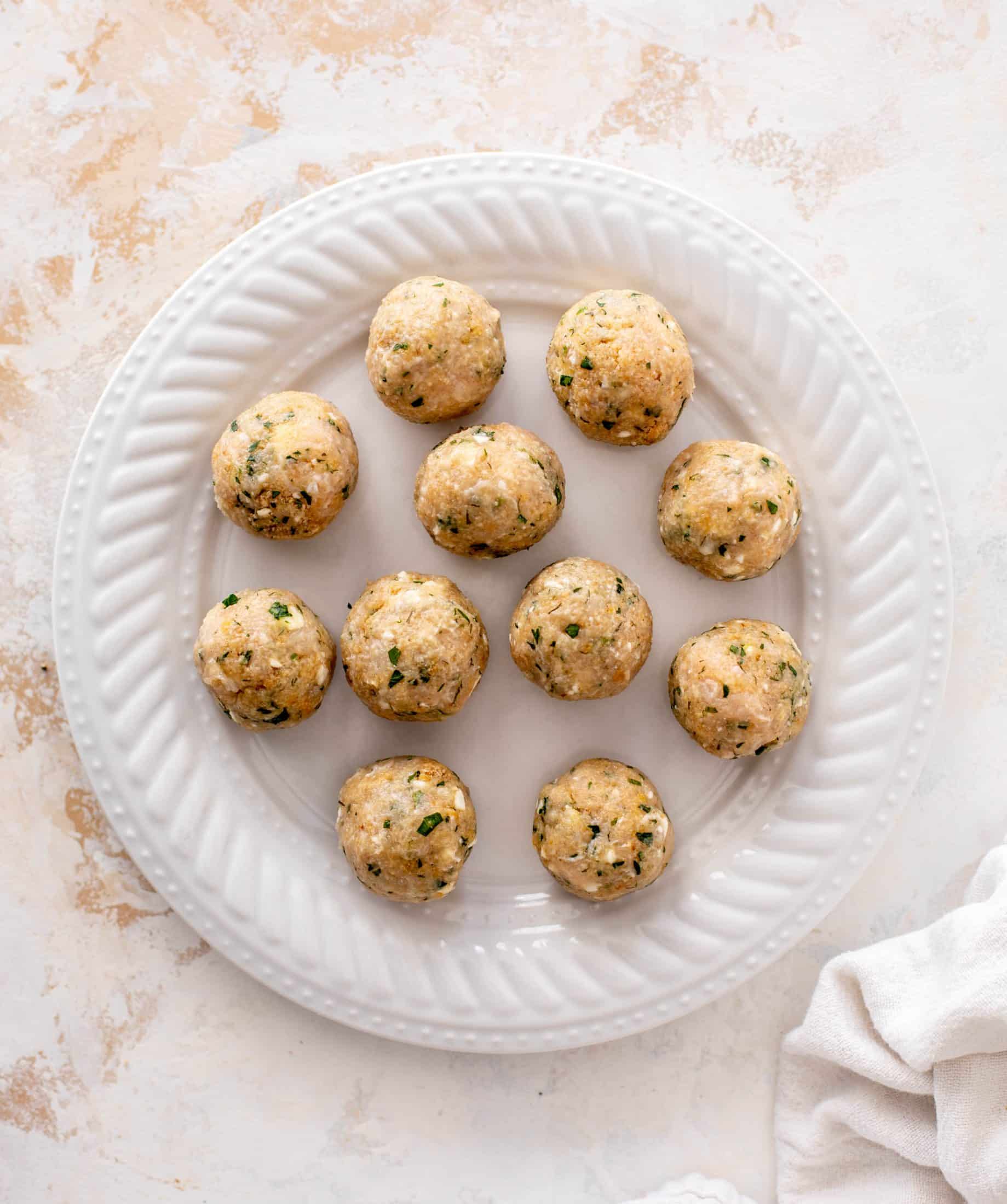 sheet pan chicken meatballs with tomatoes and feta