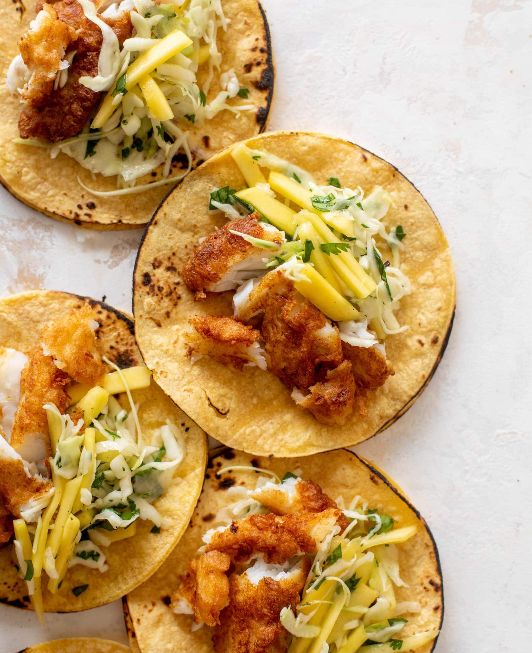 crispy fish tacos with mango slaw